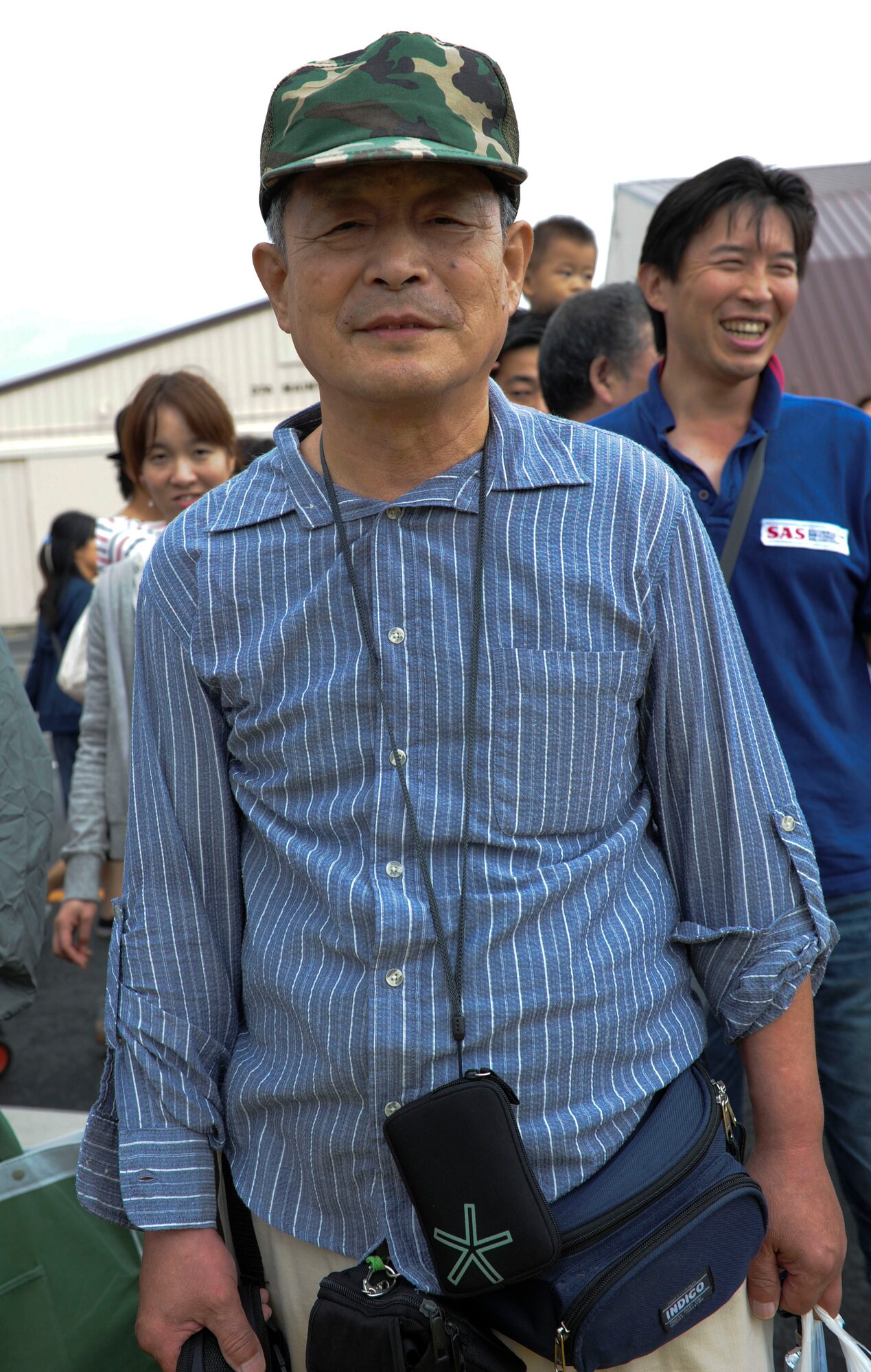 YOKOTA AIR BASE, Japan -- Takahiro Miyazaki, a guest at the 2011 Yokota Air Base Japanese-American Friendship Festival, poses for a photo Aug 21, 2011. Takahiro's favorite part about the festival was all the different food and the airplanes. This year's festival drew a crowd of approximately 117,000 visitors, offering a variety of live music, merchandise booths and American and Japanese food for everyone to enjoy. (U.S. Air Force photo / Staff Sgt. Stacy Moless) 
