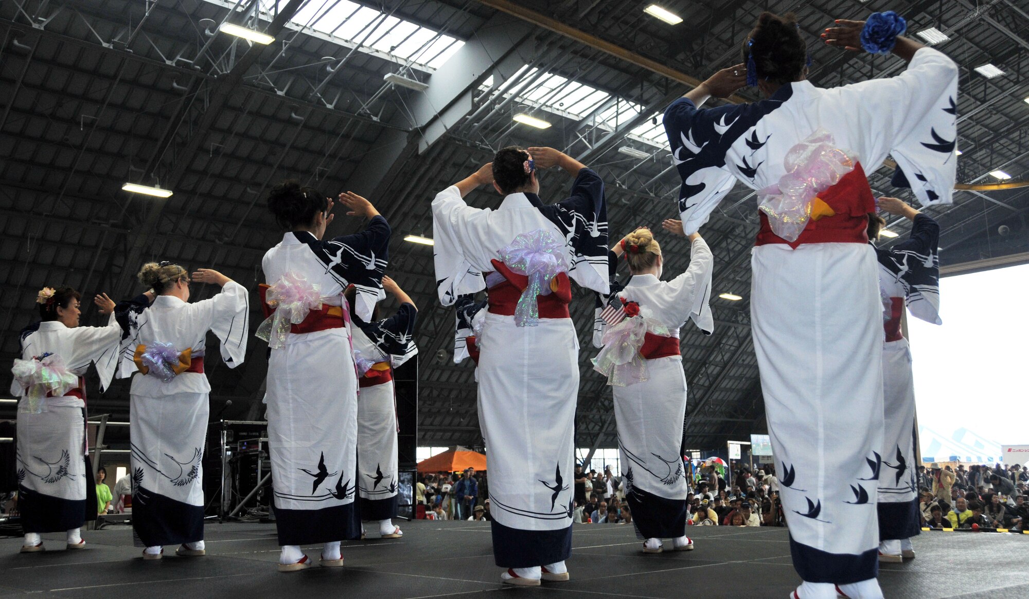 YOKOTA AIR BASE, Japan -- The Yokota Tanabata Dancers perform Minami Jujinomierushima, an Okinawan folk dance, at Yokota Air Base, Japan, Aug. 21, 2011, at the Japanese-American Friendship Festival. The dance group was one of many to perform in front of the approximately 117,000 people who attended the festival. (U.S. Air Force photo/Airman 1st Class Desiree Economides)