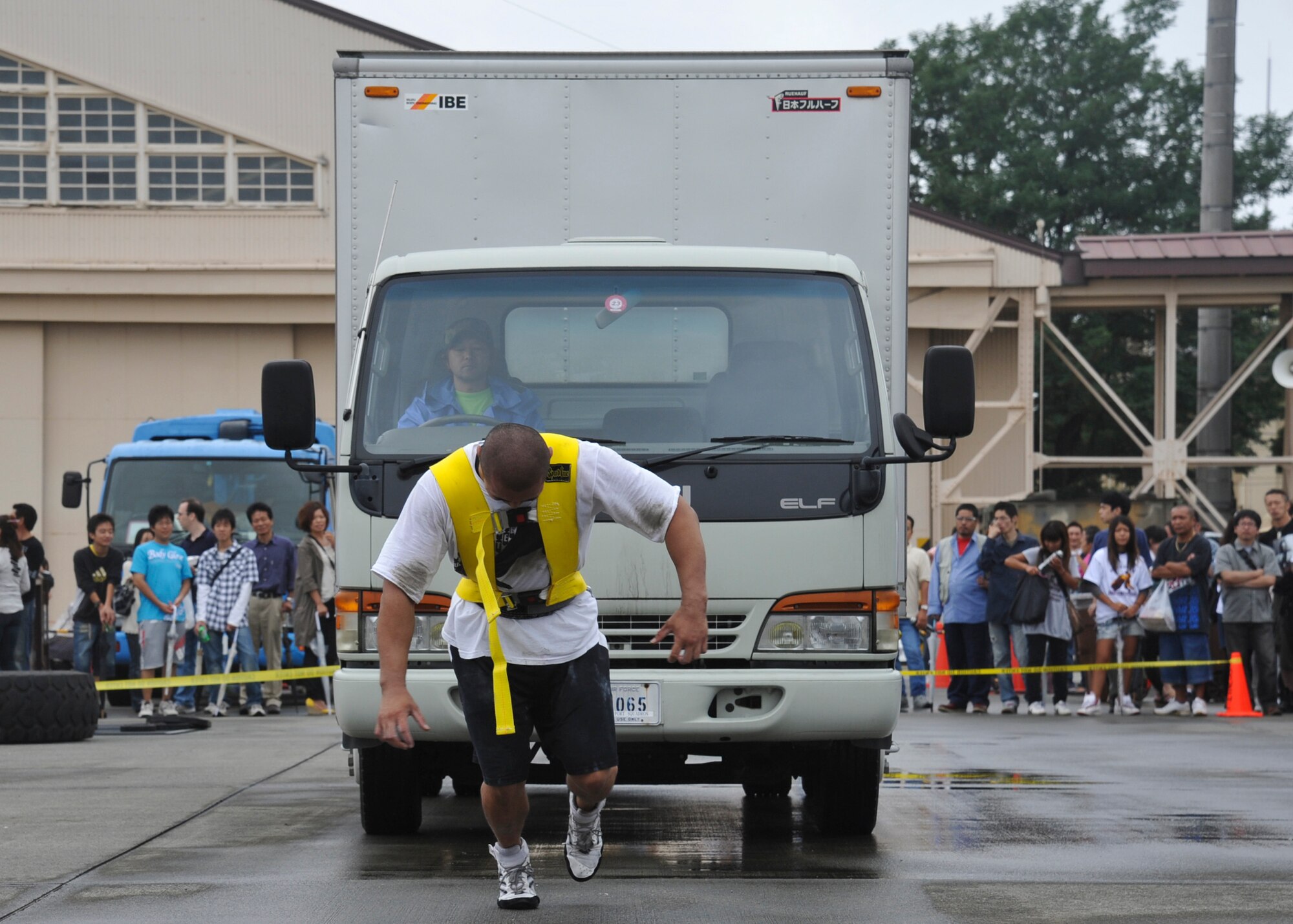 YOKOTA AIR BASE, Japan -- Takayasu Tobe pulls a truck during the last round of the 2011 Strongman Competition at Yokota Air Base, Japan, Aug. 21, 2011. A total of six competitors, four Japanese and two American, participated in the event to determine who was the strongest. (U.S. Air Force photo/Senior Airman Andrea Salazar)