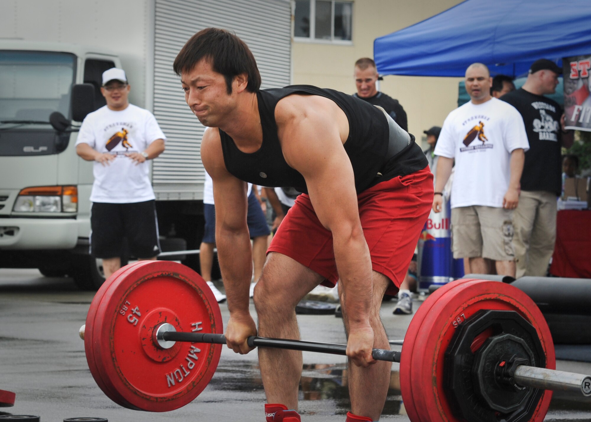 YOKOTA AIR BASE, Japan -- Tsukasa Oshimizu lifts weights equal 150 percent of his body weight during the 2011 Strongman Competition at Yokota Air Base, Japan, Aug. 21, 2011. A total of four Japanese and two Americans competed in the event to determine who was the strongest. (U.S. Air Force photo/Senior Airman Andrea Salazar)