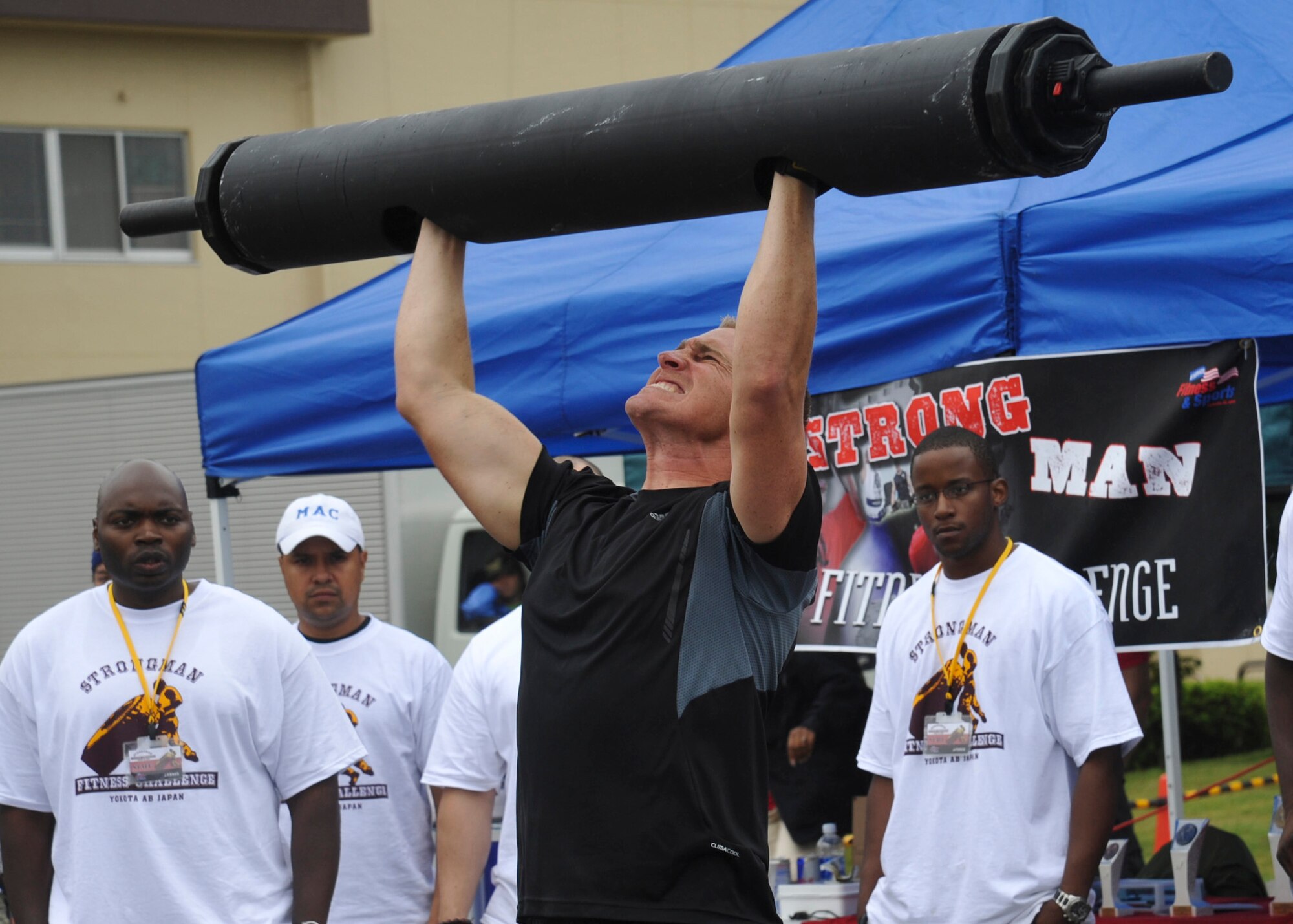 YOKOTA AIR BASE, Japan -- Staff Sgt. Travis Hoff, 374th Civil Engineer Squadron, performs "log press" repetitions during the 2011 Strongman Competition at Yokota Air Base, Japan, Aug. 21, 2011. The event showcased Yokota's military muscle while also allowing friendly competition with off-base residents. (U.S. Air Force photo/Senior Airman Andrea Salazar)