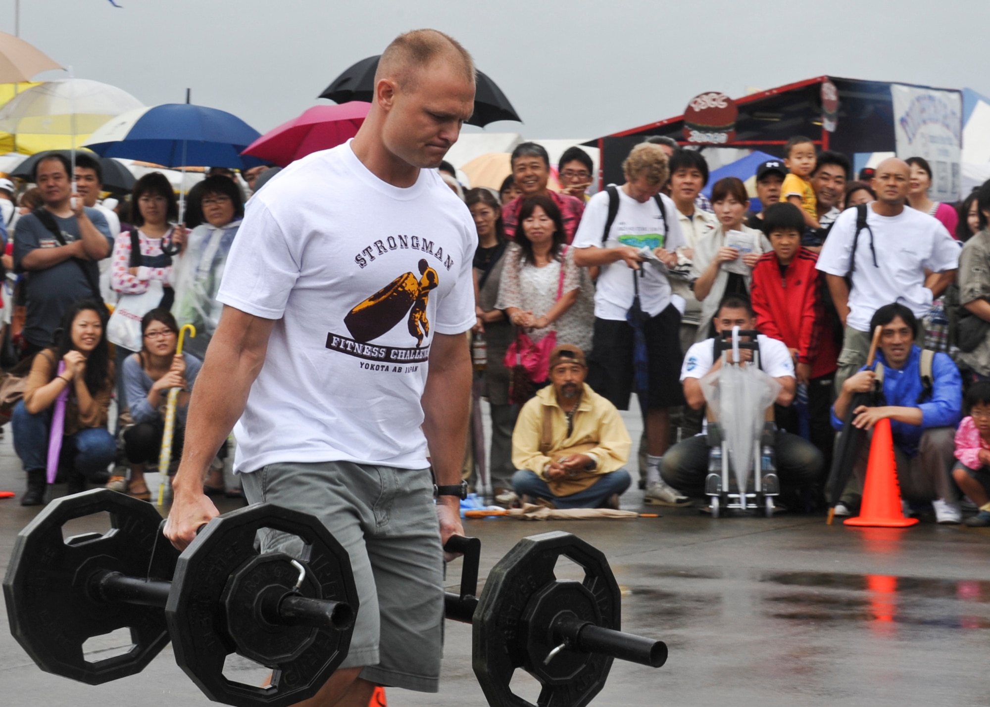 YOKOTA AIR BASE, Japan -- U.S. Marine Corps Capt. Eric Corbett, U.S. Forces, Japan, competes in the first challenge during the 2011 Strongman Competition at Yokota Air Base, Japan, Aug. 21, 2011. Japanese and Americans were allowed to participate in the competition held every year as part of Yokota's Friendship Festival. (U.S. Air Force photo/Senior Airman Andrea Salazar)