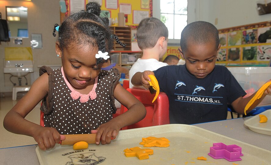 Twins Lauren and Landon Warren, 4, create various shapes with playdough at the Child Development Center on  Barksdale Air Force Base, La., Aug. 22. Playdough is used as one of many activities at the CDC to help with early production of fine motor skills including hand and eye coordination. Lauren and Landon are the children of Senior Airman Shaura Gibson, 2nd Force Support Squadron. (U.S. Air Force photo/Senior Airman Kristin High)(RELEASED) 
