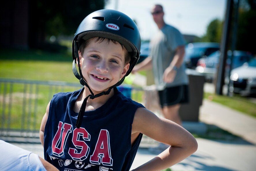 Triston, son of U.S. Air Force Tech. Sgt. Jason Fike, 38th Rescue Squadron, smiles for the camera while preparing for the bicycle portion of the Kids Triathlon at Moody Air Force Base, Ga., Aug. 20, 2011. With safety being a priority, it was mandatory for children to wear helmets during the bicycle ride. Guards were also posted at various road intersections to ensure the children had clear paths. (U.S. Air Force photo by Staff Sgt. Jamal D. Sutter/Released)