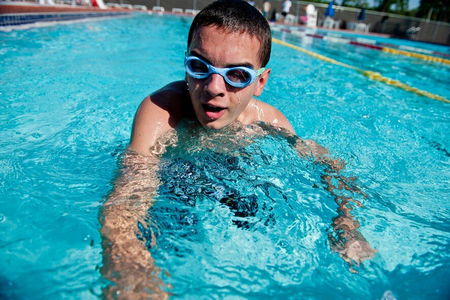 John, son of retired U.S. Air Force Master Sgt. John Green, completes a lap during the swimming portion of the Kids Triathlon at Moody Air Force Base, Ga., Aug. 20, 2011. John participated in the 11 to 14-year-old age group and won the event after finishing in 36 minutes. (U.S. Air Force photo by Staff Sgt. Jamal D. Sutter/Released)