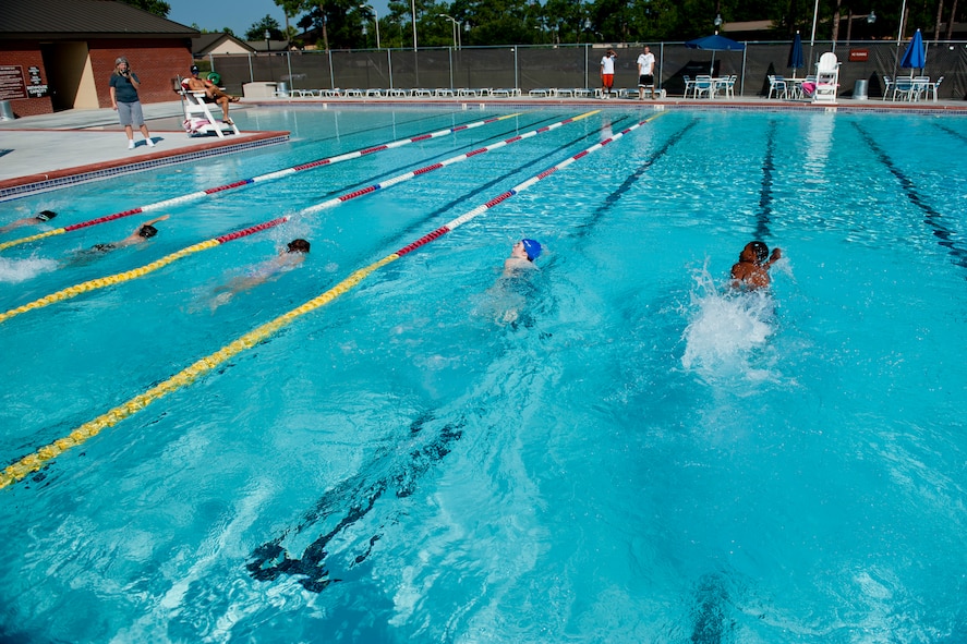 Children within the 11 to 14-year-old age group participate in the swimming portion of the Kids Triathlon at Moody Air Force Base, Ga., Aug. 20, 2011. The children completed three laps in the pool before heading to the next event. (U.S. Air Force photo by Staff Sgt. Jamal D. Sutter/Released)