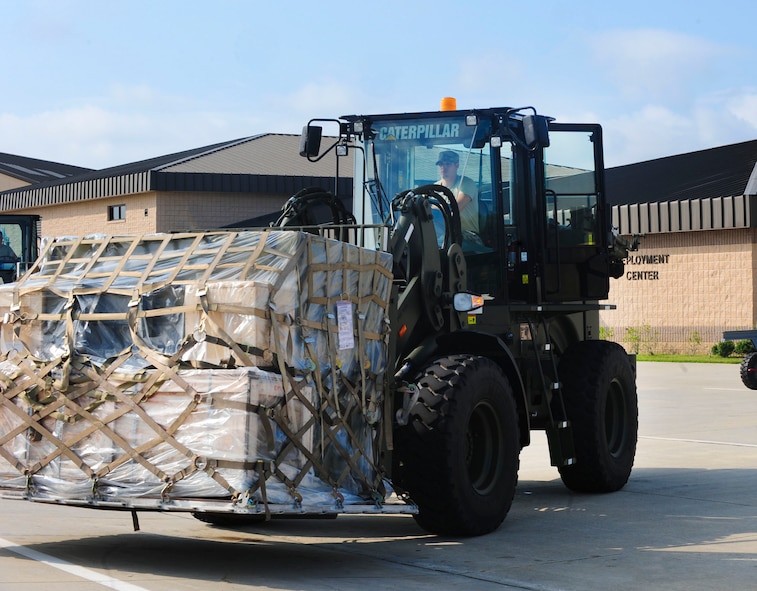 U.S. Air Force Staff Sgt. Cory Hall, 23rd Logistics Readiness Squadron vehicle operator, takes the cargo to get weighed at Moody Air Force Base, Ga., Aug. 18, 2011. The cargo is needed for the Green Flag exercise at Nellis Air Force Base, Nev., from Aug. 21 to 25. Green Flag is an air combat exercise that prepares pilots for close air support missions. (U.S. Air Force photo by Senior Airman Stephanie Mancha/Released)
