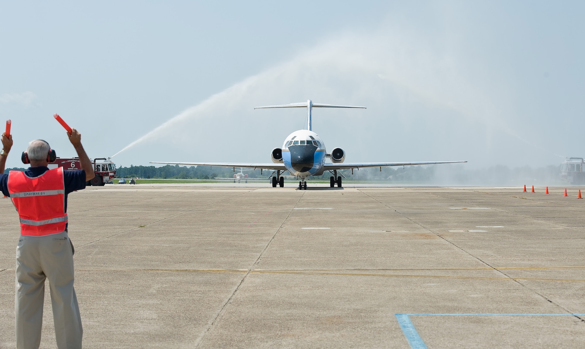 An Air Mobility Command Museum volunteer marshalls a VC-9 aircraft, also known as Air Force Two, to its parking spot at the museum at Dover Air Force Base, Del., Aug. 18, 2011. An aircrew from the 932nd Airlift Wing, Scott AFB, Ill., flew the aircraft on its final flight to the museum. Some of the dignitaries that have flown on this aircraft include former Presidents Ronald Reagan and Bill Clinton, making it Air Force One. When designated as Air Force Two, dignitaries such as former Vice Presidents George H. W. Bush, Dan Quayle and Walter Mondale have flown on this aircraft as well. (U.S. Air Force photo/Roland Balik)