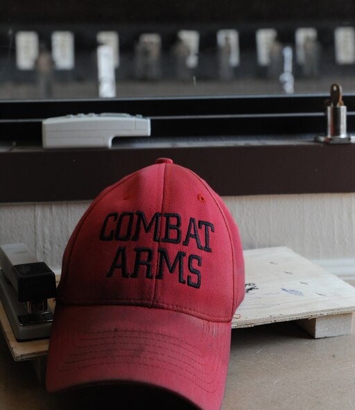 Airmen in the Combat Arms Training and Maintenance course check their targets in the firing range on Barksdale Air Force Base, La., Aug. 18. Students in the Combat Arms Training and Maintenance course fired the M-16A2 rifle, while wearing a gas mask to acclimate them with aiming the weapon in a contaminated environment. (U.S. Air Force photo/Airman 1st Class Micaiah Anthony)(RELEASED) 