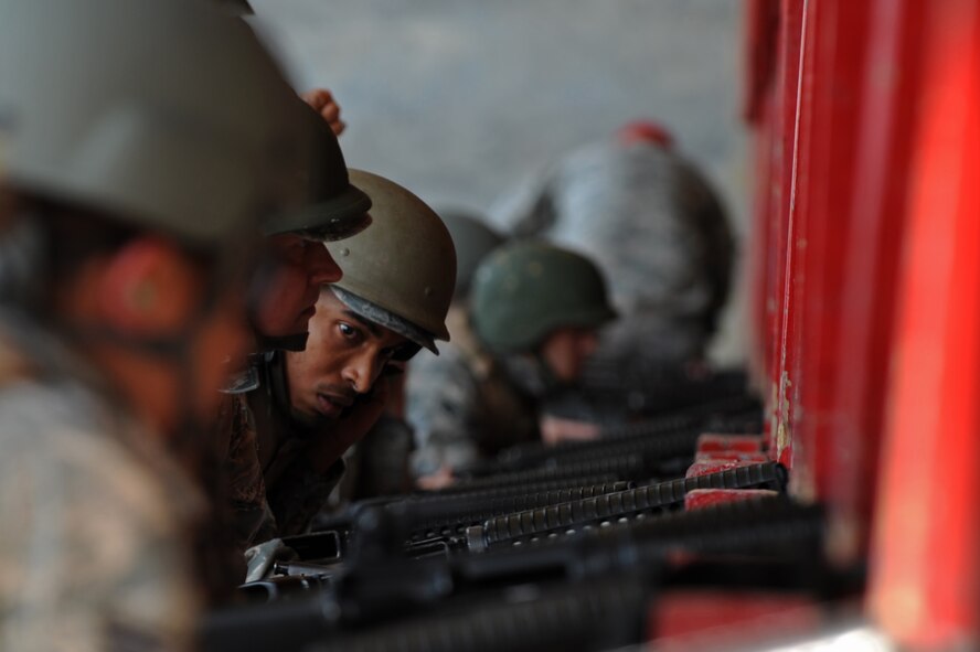 Airmen at the Combat Arms Training and Maintenance range await firing instructions on Barksdale Air Force Base, La., Aug. 18. The M-16A2 rifle is an air-cooled, gas-operated, magazine-fed, assault rifle with a muzzle velocity of 3,110 feet per second. (U.S. Air Force photo/Airman 1st Class Micaiah Anthony)(RELEASED)