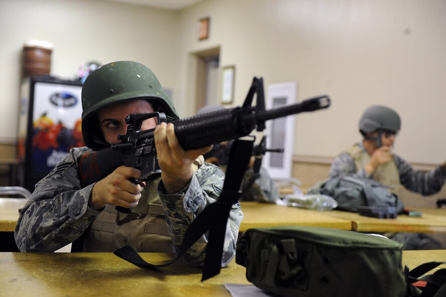 Senior Airman Daniel Chabot, 2nd Operations Support Squadron, looks down the site of an M-16A2 rifle during the Combat Arms Training and Maintenance course on Barksdale Air Force Base, La., Aug. 18. The M-16A2 rifle is an air-cooled, gas-operated, magazine-fed, assault rifle with a muzzle velocity of 3,110 feet per second. (U.S. Air Force photo/Airman 1st Class Micaiah Anthony)(RELEASED)