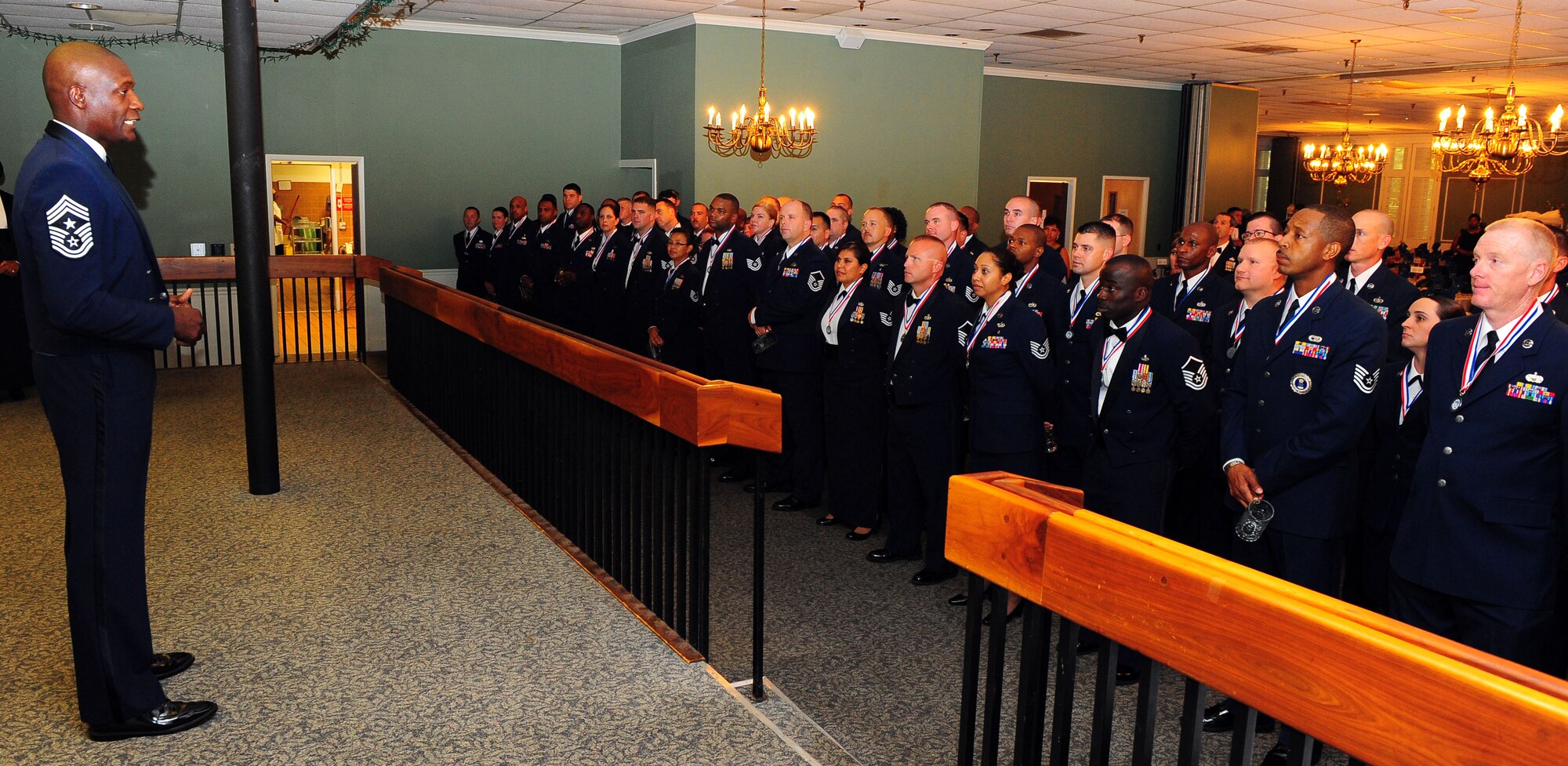 Chief Master Sgt. Lefford L. Fate, 20th Fighter Wing command chief, congratulates the newly selected senior NCO inductees at Shaw Air Force Base, S.C. Aug. 19, 2011. The new master sergeants and master sergeant selects gathered to celebrate their promotions to the senior NCO ranks at an official ceremony held at the Carolina Skies club.  (U.S. Air Force photo/Airman 1st Class Neil D. Warner)(Released)