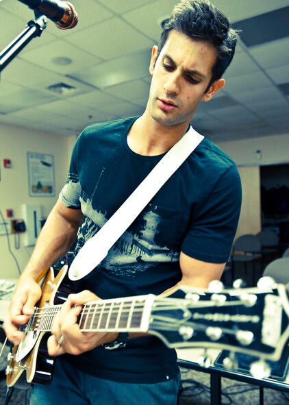 Staff Sgt. Jacob John, of the 96th Civil Engineer Squadron, is the lead singer and guitarist for the band, Sonic Cell.  The four-person alternative rock band is made up of enlisted Airmen from the 96th Air Base Wing.  (U.S. Air Force photo/Samuel King Jr.)