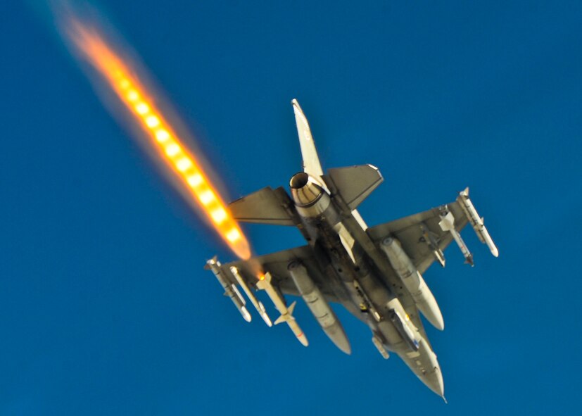 A F-16 Fighting Falcon fires an air-to-air missile during a weapons system evaluation program mission at Hill Air Force Base, Utah.  The WSEP missions of Combat Hammer and Combat Archer are part of an annual month-long event held at the base by the 53rd Weapons Evaluation Group.  The group is responsible for air-to-ground and air-to-air weapons evaluation.  (Courtesy photo)