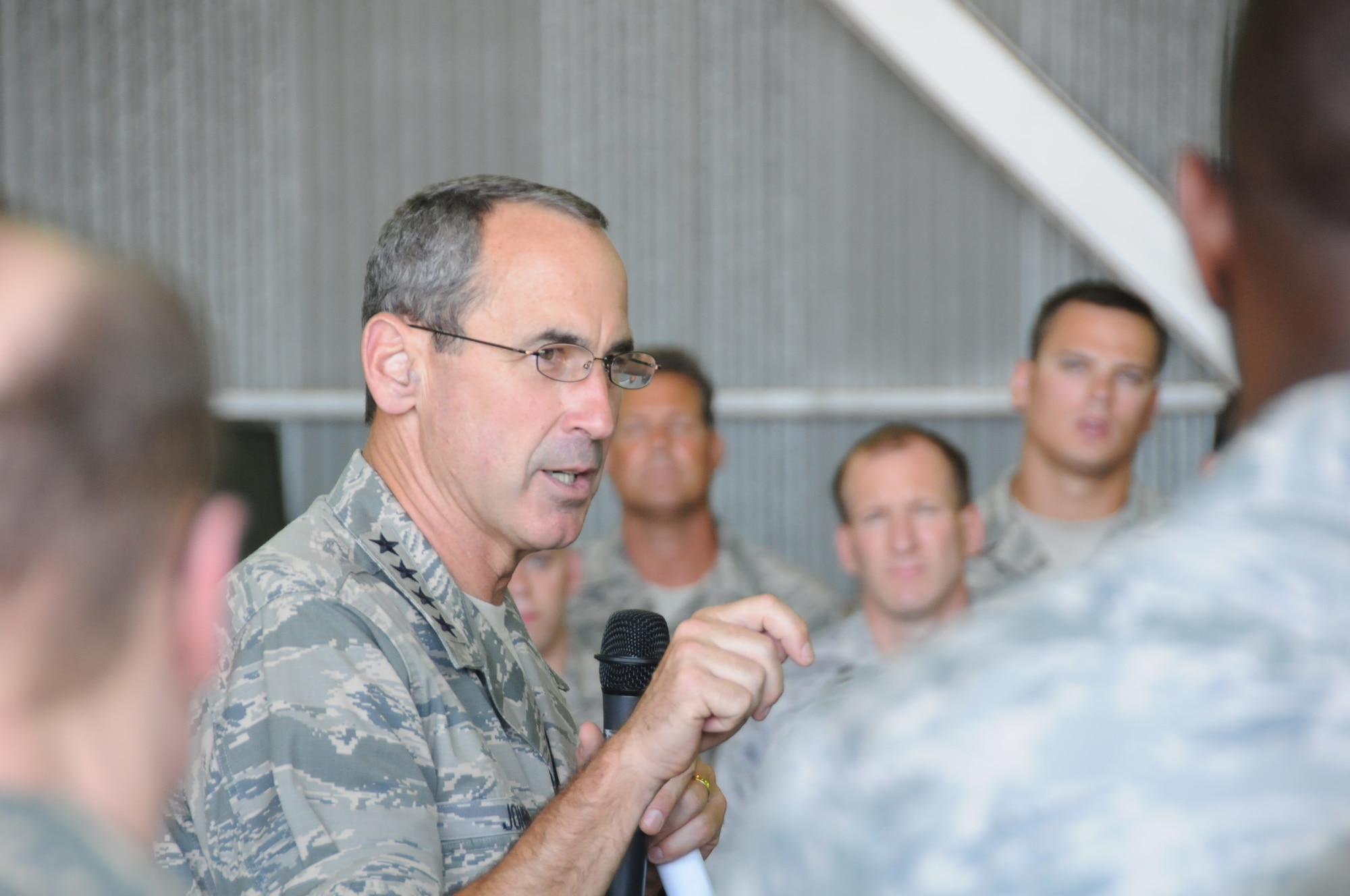 Gen. Raymond E. Johns Jr., Air Mobility Command commander, speaks with Airmen of the 313th Air Expeditionary Wing at a non-disclosed base in Western Europe on Aug. 16, 2011. The general answered questions and addressed issues and concerns and also thanked Airmen for their service and the ability to answer the nation's call at a moment's notice. The wing supports Operation Unified Protector, a NATO-led mission in Libya to protect civilians and civilian-populated areas under threat of attack. The 313th AEW provides aerial refueling to U.S. and coalition aircraft with KC-135 Stratotankers and KC-10 Extenders. (U.S. Air Force Photo/1st Lt. Rusty Ridley)