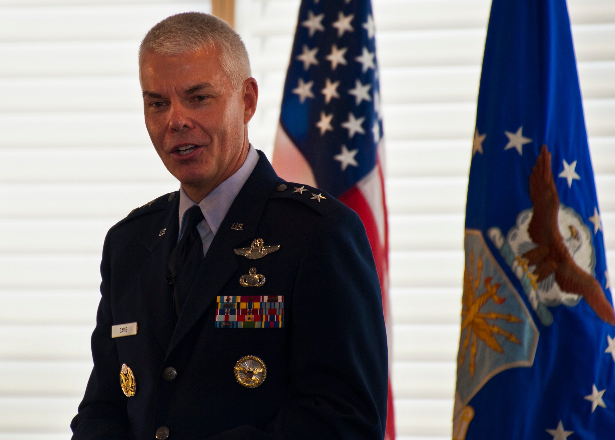Maj. Gen. Charles R. Davis addresses his wings and local community leaders for the last time as commander of the Air Armament Center during his change of command ceremony at Eglin Air Force Base, Fla., Aug. 19.  Maj. Gen. Kenneth Merchant took command of the center from Davis.  (U.S. Air Force photo/Samuel King Jr.)