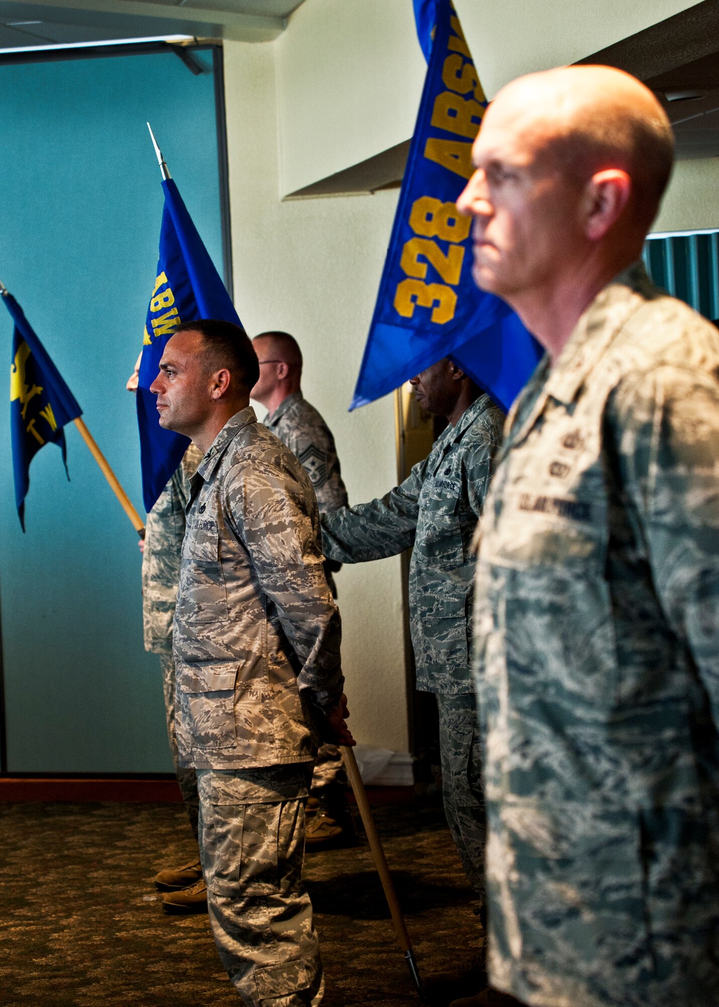 Three formations stand at parade rest prior to the Air Armament Center change of command ceremony at Eglin Air Force Base, Fla., Aug. 19.  Maj. Gen. Kenneth Merchant took command of the center from Maj. Gen. Charles R. Davis.  (U.S. Air Force photo/Samuel King Jr.)