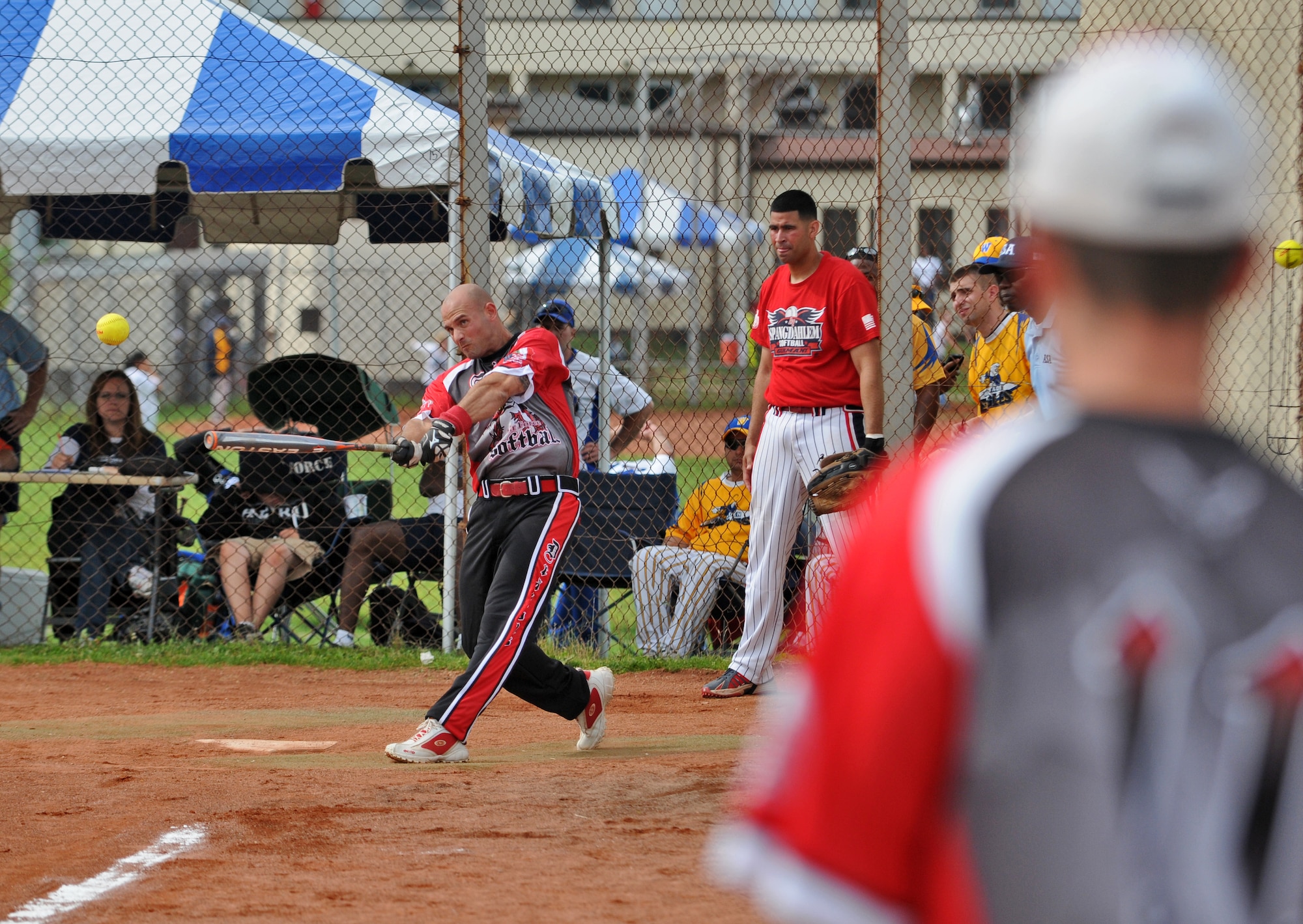 SPANGDAHLEM AIR BASE, Germany – Brian Price, Aviano Dodgers, hits the ball during a U.S. Forces Europe men’s softball round-robin tournament game against the Spangdahlem Sabers here Aug. 18. The Sabers defeated the Dodgers 18-11. Both male and female U.S. Forces softball teams from the Army and Air Force, including the Spangdahlem Saber teams, participated in the annual event.  (U.S. Air Force photo/Senior Airman Nick Wilson)