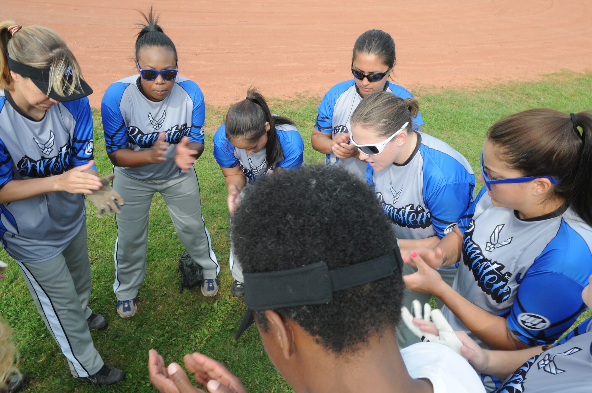 SPANGDAHLEM AIR BASE, Germany – Ladies from the Ramstein Rams sing their team chant before a U.S. Forces Europe women’s softball round-robin tournament game against the Schweinfurt Ninjas here Aug. 18. The Rams defeated the Ninjas 22-0. Both male and female U.S. Forces softball teams from the Army and Air Force, including the Spangdahlem Saber teams, participated in the annual event.  (U.S. Air Force photo/Senior Airman Nick Wilson)