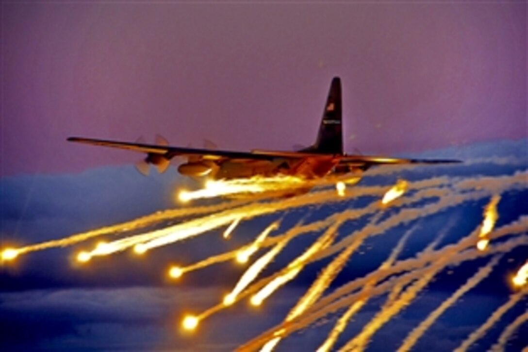 A C-130 aircraft launches flares over Lake Ontario during a training exercise near Niagara Falls, N.Y., Aug. 10, 2011. The C-130 crew is assigned to the Niagara Falls Air Reserve Station. Crews can launch flares as a defensive measure against hostile forces.