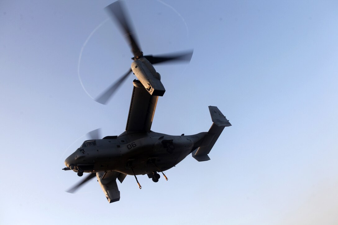 An MV-22B Osprey, with Marine Medium Tilt Rotor Squadron (VMM) 263 (Reinforced), 22nd Marine Expeditionary Unit (MEU), flies over the Gulf of Aden from amphibious assault ship USS Bataan (LHD 5) to Military Sealift Command dry cargo and ammunition ship USNS Wally Schirra (T-AKE 8) during the first external lift in support of a vertical replenishment for the Osprey, Aug. 22, 2011. The 22nd MEU is currently deployed as part of the Bataan Amphibious Ready Group (BATARG) as the U.S. Central Command theater reserve force, also providing support for maritime security operations and theater security cooperation efforts in the U.S. 5th Fleet area of responsibility.