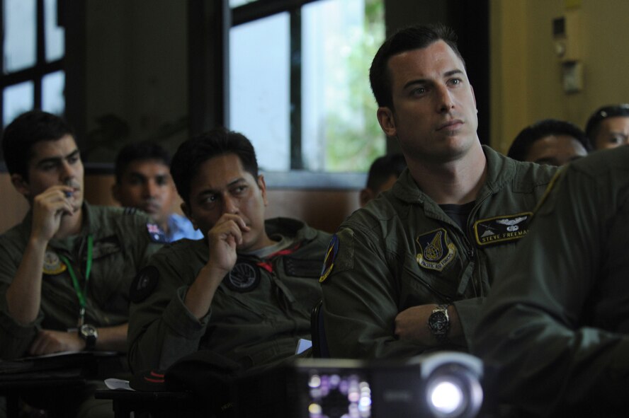 A row of aircrew members from the U.S. Air Force, the Royal Malaysian Air Force, the Royal Australian Air Force listen to a procedures and guidelines at a joint flight brief at Ratmalana Airport, Colombo, Sri Lanka on Aug. 22 for the start of Pacific Airlift Rally 2011, a Pacific Air Force sponsored, biennial multilateral tactical military airlift symposium. Airmen from the Royal Australian Air Force (RAAF), the Sri Lankan Air Force, the Royal Malaysian Air Force and the U.S. Air Force are participating in the one-week exercise. The exercise enhances military airlift interoperability and cooperation between the nations of the Indo-Pacific region. (DoD photo/Master Sgt. Cohen A. Young)