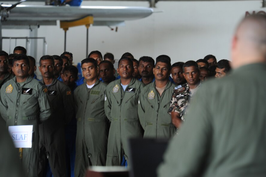 COLOMBO, Sri Lanka – Members of the Sri Lanka Air Force stand "At Ease" while listening to remarks from Lt Col Tim Rapp, the commander of the 36th Expeditionary Squadron in formation at Ratmalana Airport, Colombo, Sri Lanka on Aug. 22 for the opening ceremony of Pacific Airlift Rally 2011, a Pacific Air Force sponsored, biennial multilateral tactical military airlift symposium. Airmen from the Royal Australian Air Force (RAAF), the Sri Lankan Air Force, the Royal Malaysian Air Force and the U.S. Air Force are participating in the one-week exercise. The exercise enhances military airlift interoperability and cooperation between the nations of the Indo-Pacific region. (DoD photo/Master Sgt. Cohen A. Young)