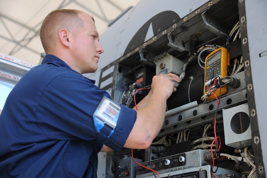 U.S. Air Force Staff Sgt. Ryan Ball, A-10 East Demonstration Team avionics specialist, spot checks wires before beginning to repair an A-10C Thunderbolt II at Moody Air Force Base, Ga., Aug. 24, 2011. Ball checked the wires during a troubleshooting process before evaluating the aircraft. (U.S. Air Force photo by Airman 1st Class Paul Francis/Released)