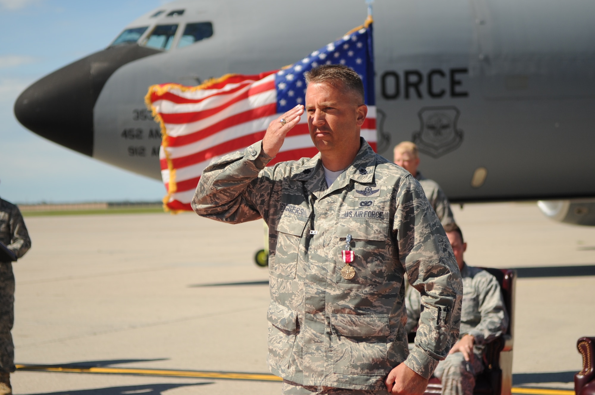 Lt. Col. Darin Driggers, former commander of the 319th Operations Support Squadron, receives his final salute during the 319th OSS Change of Command on Grand Forks Air Force Base Aug 19. The Change of Command is a time-honored tradition in the military which visibly assures continuity of command. This is represented by the unit flag being passed from the present commander to the future commander. (U.S Air Force photo by Senior Airman Amanda N. Stencil)
