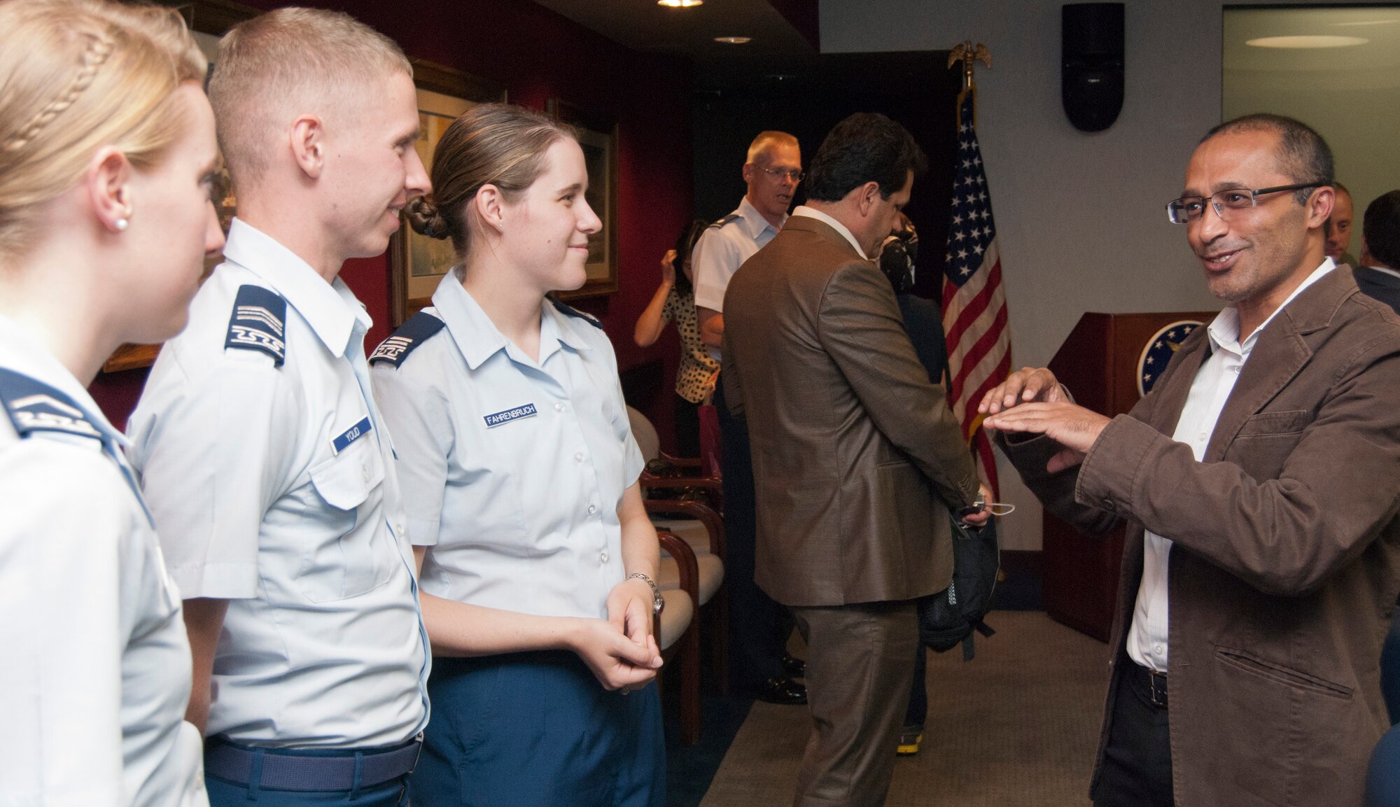 Cadets on the Air Force Academy's Cadet Interfaith Council speak with Bidhayak Das during a visit by journalists from Asian nations Aug. 22, 2011. The East-West Center's 2011 Senior Journalists Seminar is designed to improve lines of communication among American and Asian news media. Das is the Asia correspondent for the Eastern Chronicle in Guwhati, India. (U.S. Air Force photo/Don Branum)