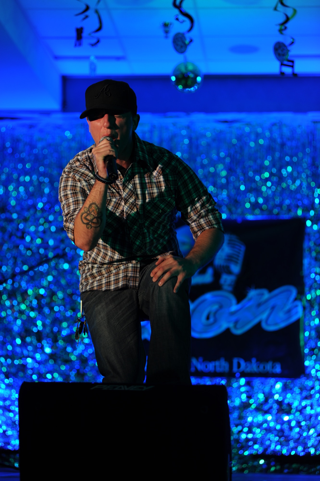 Airman 1st Class Erich Defoe, member of the 319th Logistics Readiness Squadron, performs “Stellar” by Incubus at the Air Mobility Command Icon Contest on Grand Forks Air Force Base Aug 18. AMC Icon’s contest is conducted annually and is a great way for GFAFB members to be center stage while highlighting their talents. The AMC Icon’s top performer will represent GFAFB at AMC Headquarters Scott AFB Illinois in October. (U.S. Air Force photo by Senior Airman Amanda N. Stencil)
