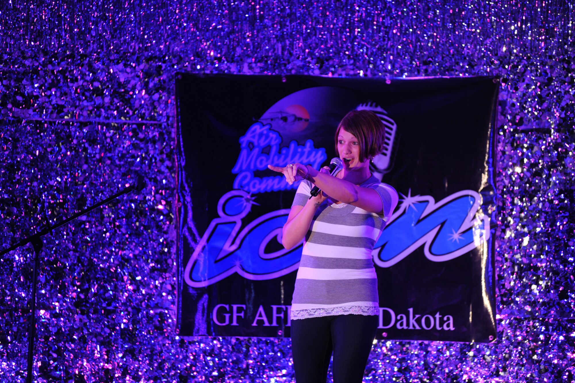Senior Airman Whitney Montoya, member of the 319th Security Forces Squadron, performs “From the Moment On” by Shania Twain at the Air Mobility Command Icon Contest on Grand Forks Air Force Base Aug 18. AMC Icon’s contest is conducted annually and is a great way for GFAFB members to be center stage while highlighting their talents. The AMC Icon’s top performer will represent GFAFB at AMC Headquarters Scott AFB Illinois in October. (U.S. Air Force photo by Senior Airman Amanda N. Stencil)