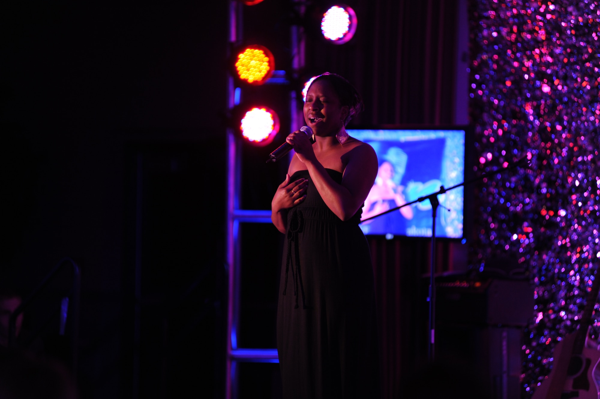 Airman 1st Class Claudia Robinson, member of the 319th Force Support Squadron, performs “Dangerously In Love” by Beyonce at the Air Mobility Command Icon Contest on Grand Forks Air Force Base Aug 18. AMC Icon’s contest is conducted annually and is a great way for GFAFB members to be center stage while highlighting their talents. The AMC Icon’s top performer will represent GFAFB at AMC Headquarters Scott AFB Illinois in October. (U.S. Air Force photo by Senior Airman Amanda N. Stencil)