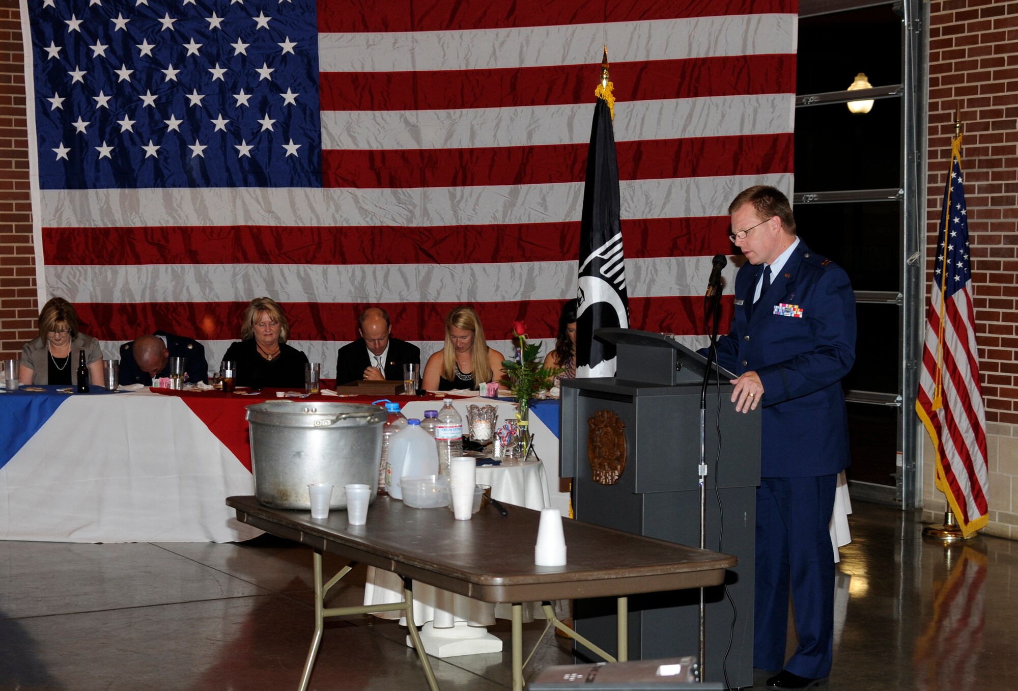 Capt. Shane Pair, a chaplain with the 188th Fighter Wing, gives the invocation at a formal dining-in ceremony held in Fort Smith Aug. 10 by the 188th Civil Engineering Squadron. The objective of the ceremony was to help foster squadron camaraderie before the unit ventured to Tyndall Air Force Base, Fla.,  to participate in Exercise Silver Flag during annual training. (U.S. Air Force photo by Senior Master Sgt. Dennis Brambl)