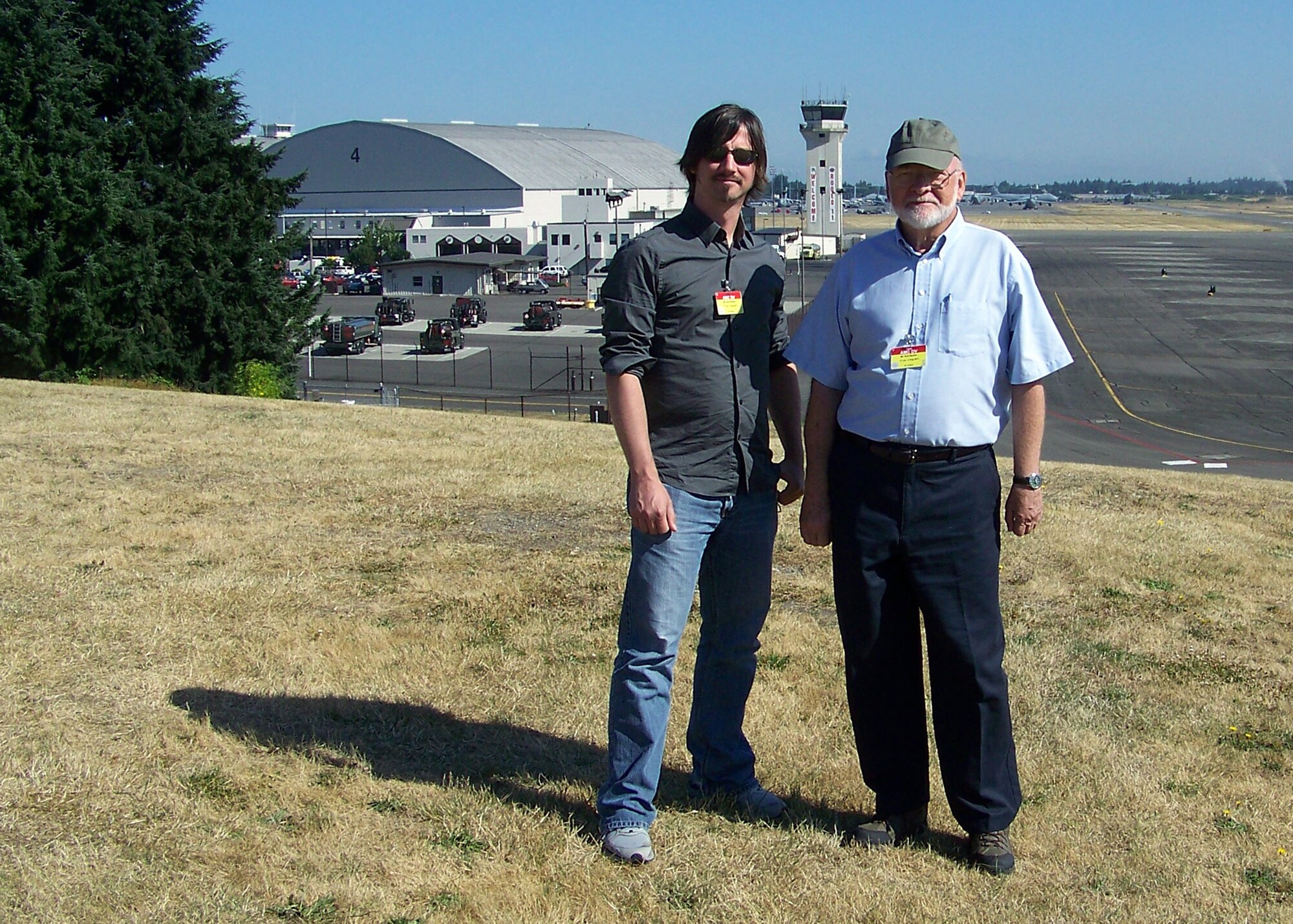 Artists Scott Bakal and Paul Rendel, both civilian artists who support the Air Force Art Program, stop for a photo during their attendance to Air Mobility Rodeo 2011 at Joint Base Lewis-McChord, Wash., on July 28, 2011. Bakal is from Boston, Mass., and Rendel is from Milton, Del. Both are also part of the New York Society of Illustrators. (Courtesy Photo)