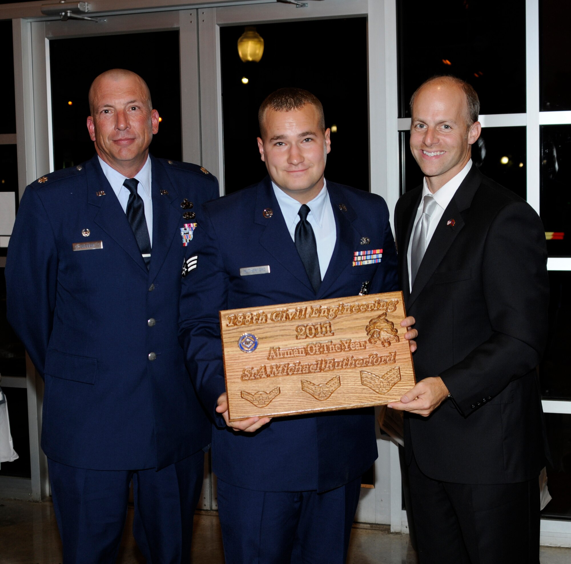 From left: Lt. Col. Pete Gauger, 188th Mission Support Group commander; Senior Airman Michael Rutherford, 188th Civil Engineering Squadron Airman of the Year for 2011; and Arkansas Senator Jake Files. Senator Files was the guest speaker at the 188th CES’ formal dining-in ceremony Aug. 10. Airman Rutherford was named the squadron’s most outstanding Airman during the event. (U.S. Air Force photo by Senior Master Sgt. Dennis Brambl)


