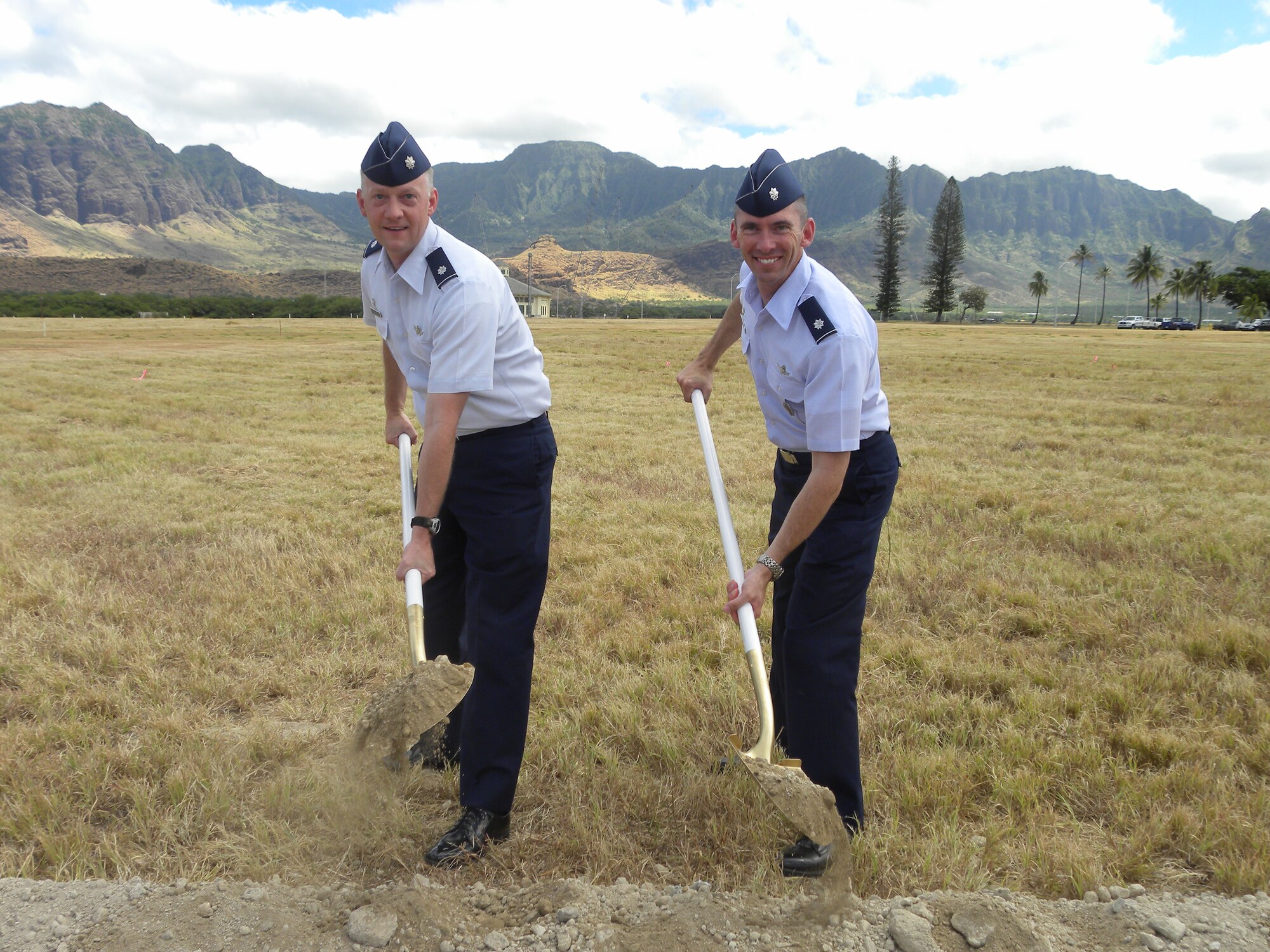 Lt. Col. Bob Claude (left), 380th Space Control Squadron commander, and Lt. Col. Roger Sherman, 16th SPCS commander, break ground on a new Rapid Attack, Identification, Detection and Reporting System site July 28 in Hawaii. Information from the site will be monitored by the 16th and 380th SPCS at Peterson AFB, to detect interference and safeguard Department of Defense communications system signals. (Courtesy photo)