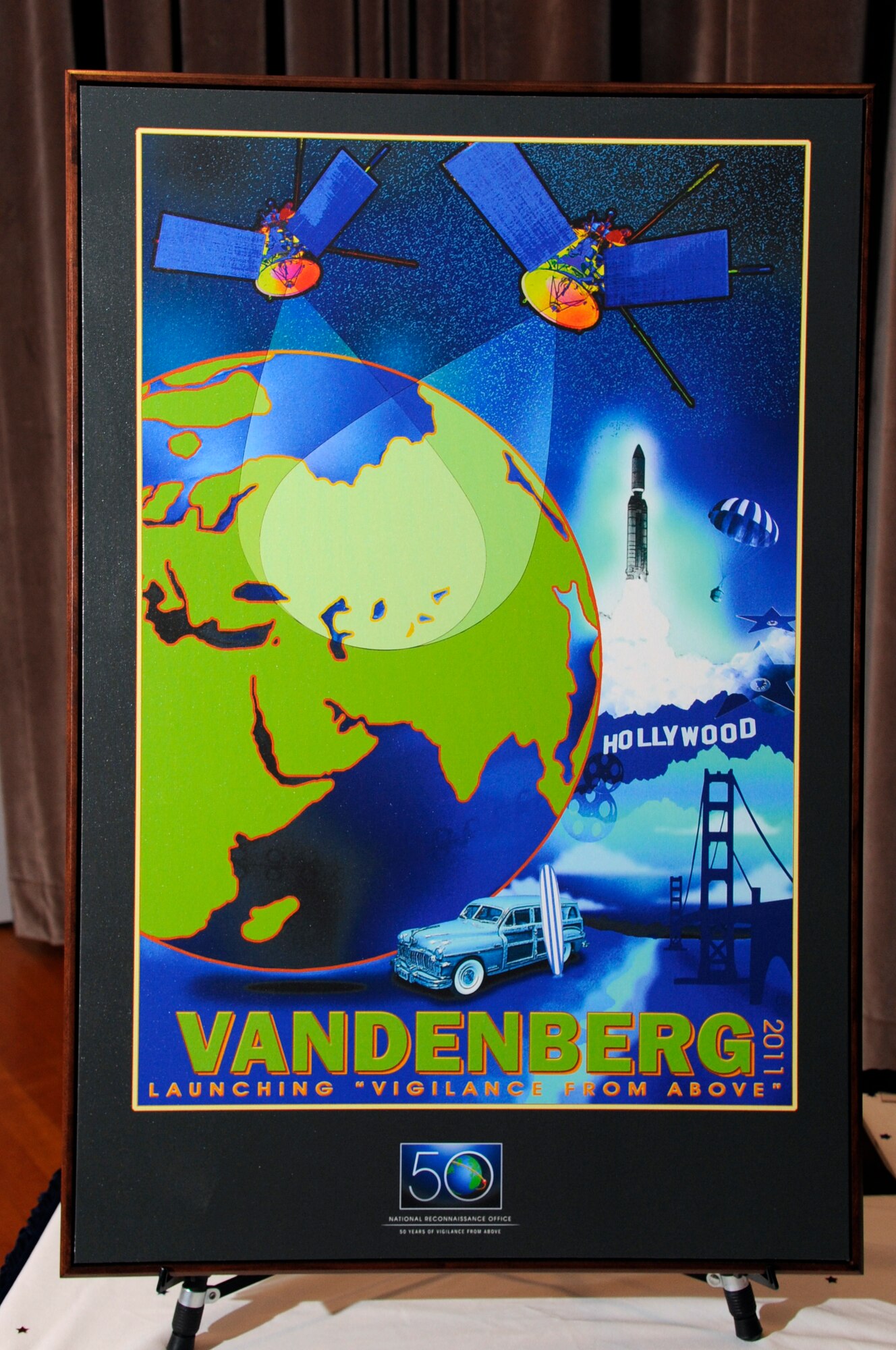 VANDENBERG AIR FORCE BASE, Calif. – The director of the National Reconnaissance Office, Bruce Carlson, presented the men and women of the 30th Space Wing and NRO-Vandenberg with a plaque honoring their support to the NRO mission over the past 50 years during a ceremony at the base theater at 1 p.m. Monday, Aug. 15, 2011.(U.S. Air Force photo/Jerry E. Clemens)
