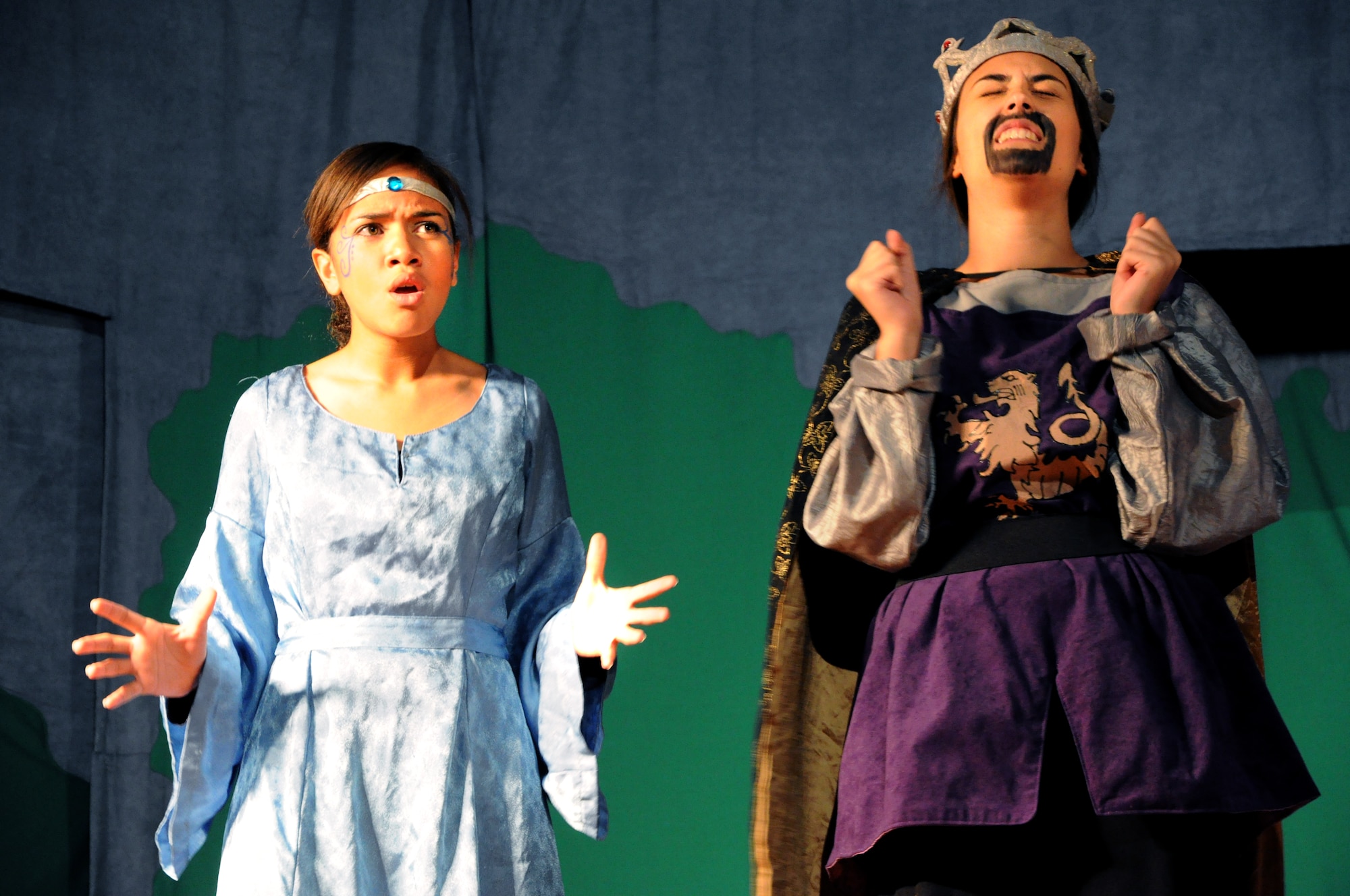 GOODFELLOW AIR FORCE BASE, Texas -- (From left:) Lady of the Lake, played by Desirea Etheridge, gets upset with King Arthur, played by Emily Hunnemeyer, for losing his sword during the Missoula Children's Theatre's production of King Arthur's Quest at the base theater here Aug. 20.  More than 50 youths signed up for this year's event which was cast and rehearsed in one week.  (U.S. Air Force photo/Connie Hempel)