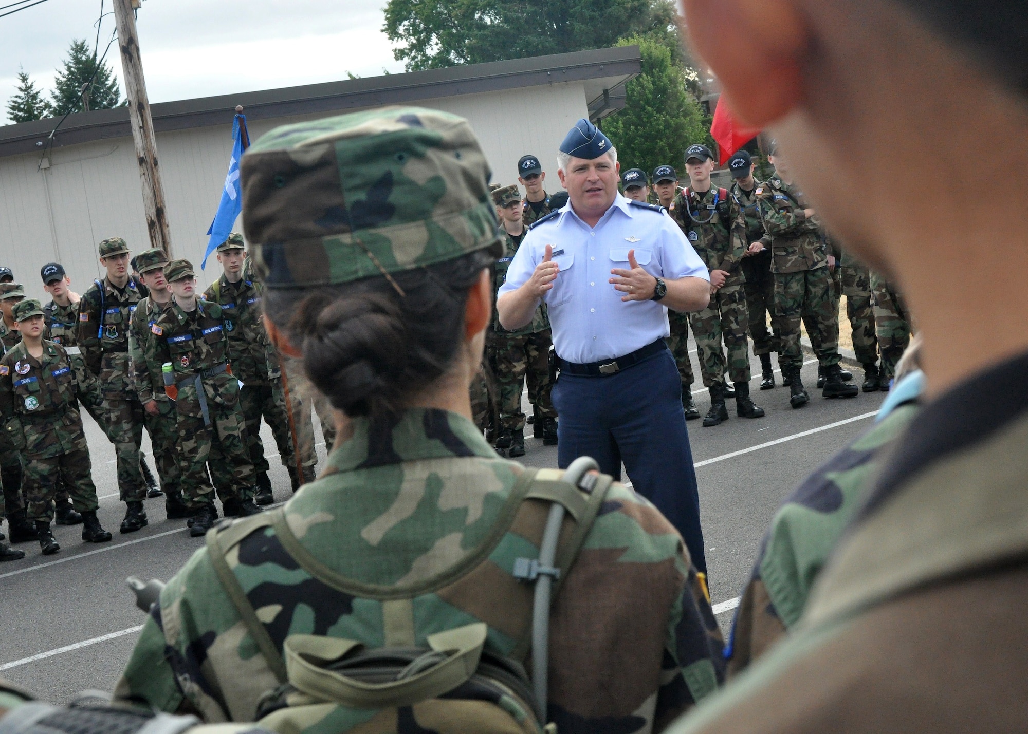 Col. Paul Eberhart, 62nd Operations Group commander, speaks to a group of Civil Air Patrol cadets August 15, 2011, at Joint Base Lewis-McChord, Wash. The CAP cadets received a 62nd Airlift Wing mission briefing and then spend the day touring multiple organizations throughout the wing. (U.S. Air Force photo/Airman 1st Class Leah Young)