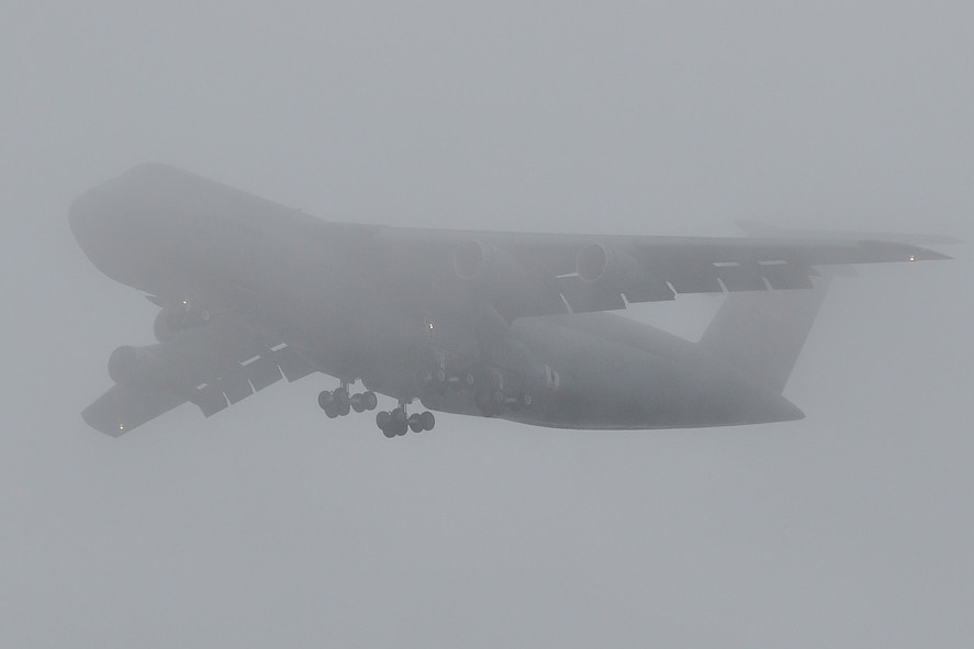 A Patriot Wing C-5B Galaxy makes its way through the fog over North Kingstown, R.I., in June, just before landing for the Quonset Air Show. When mission requirements allow, Westover aircrews fly to air shows in greater New England and other locations.  A Westover C-5 was also on display in August at the Boston-Portsmouth Air Show.(Courtesy photo provided by Ken Middleton)