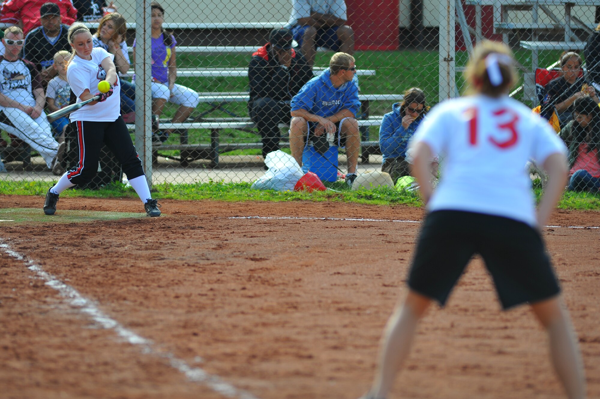 SPANGDAHLEM AIR BASE, Germany – Kristen Giras, Spangdahlem Lady Sabers, hits a softball during the U.S. Armed Forces in Europe softball championship here Aug. 19. The Spangdahlem Lady Sabers beat the Incirlik Lady Sultans 14-0 in this preliminary game. The Ramstein Lady Rams beat the Lakenheath Lady Eagles 5-4, and the Ramstein Rams beat the Aviano Dragons 28-16 in the final championship games. Both male and female U.S. Forces softball teams from the Army and Air Force, including the Spangdahlem Saber teams, participated in the annual event. (U.S Air Force photo/Airman 1st Class Dillon Davis)