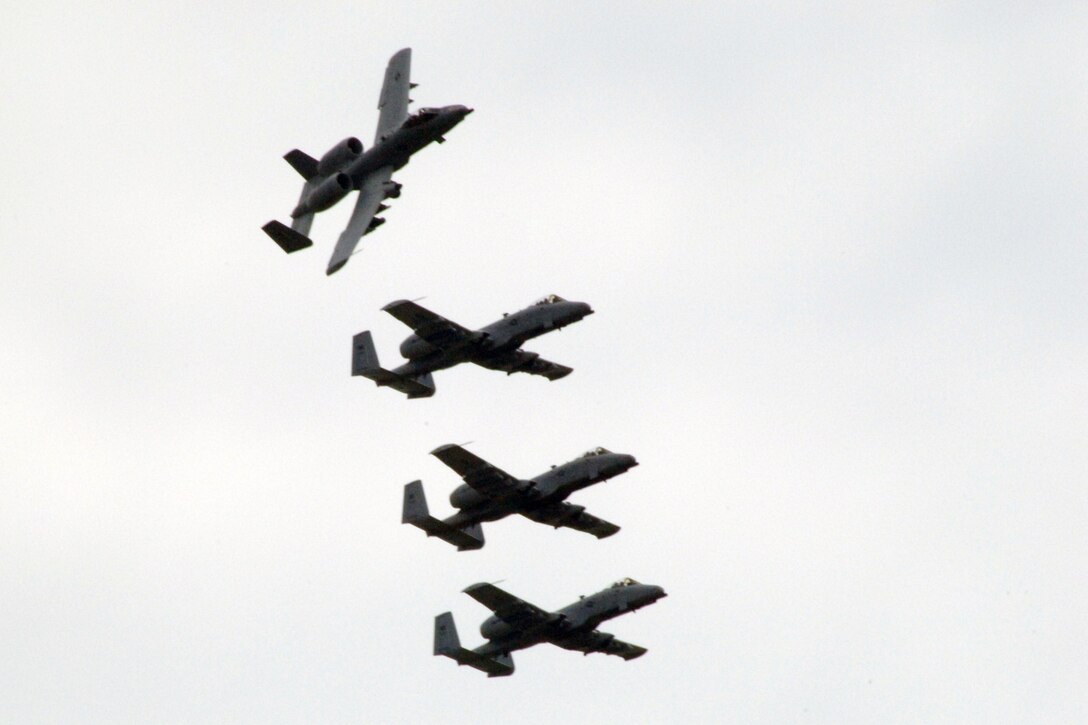 A four-ship formation of A-10 Thunderbolt II aircraft pass overhead during the 2011 Selfridge Air Show and Open House at Selfridge Air National Guard Base, Mich., Aug. 20, 2011. The A-10’s are flown by the 107th Fighter Squadron at Selfridge. (USAF photo by John S. Swanson)