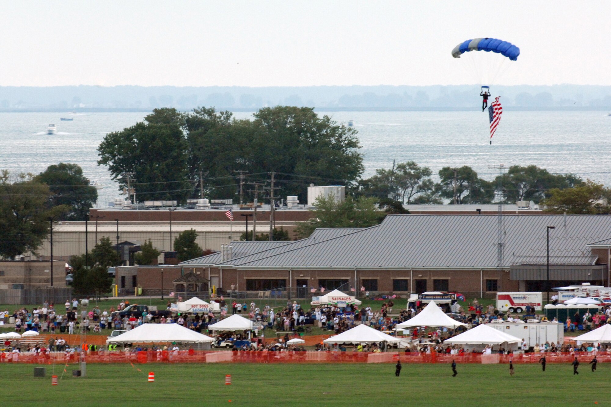A U.S. Air Force Academy cadet brings in the U.S. flag during a parachute performance by the Academy’s Wings of Blue team at the 2011 Selfridge Air Show and Open House at Selfridge Air National Guard Base, Mich., Aug. 20, 2011. (USAF photo by John S. Swanson)