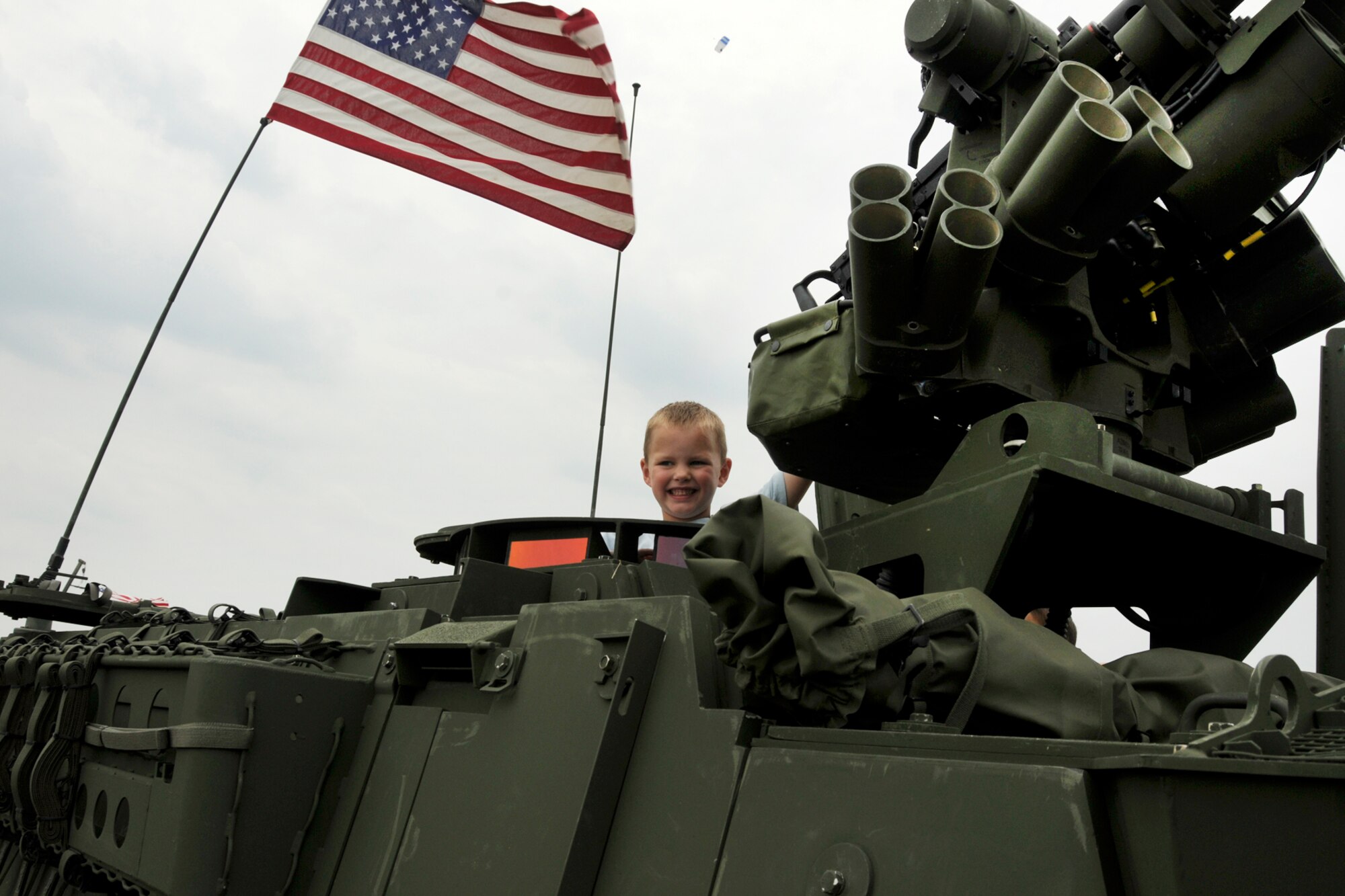 An air show visitor checks out some Army hardware during his visit to the 2011 Selfridge Air Show and Open House at Selfridge Air National Guard Base, Mich., Aug. 20, 2011. All branches of the U.S. Armed Forces and several Dept. of Homeland Security agencies had equipment on display and provided information at the air show. (USAF photo by TSgt. David Kujawa)