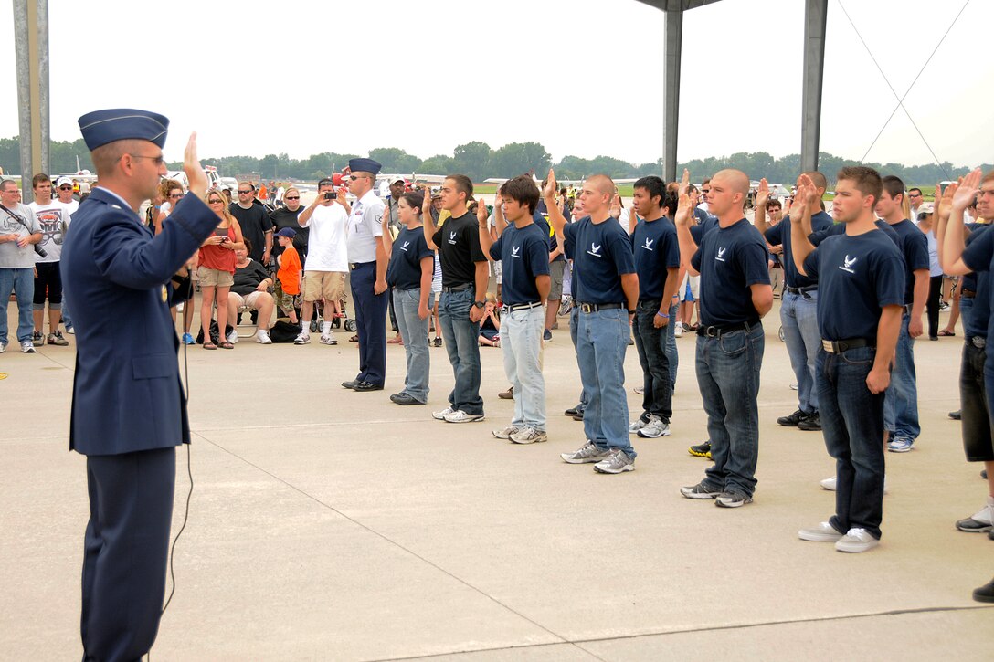 Lt. Col. Wade A. Mueller, commander of the 339th Recruiting Squadron, swears in a group of 63 new recruits during a ceremony at the 2011 Selfridge Air Show and Open House at Selfridge Air National Guard Base, Mich., Aug 20, 2011. (USAF photo by TSgt. David Kujawa)