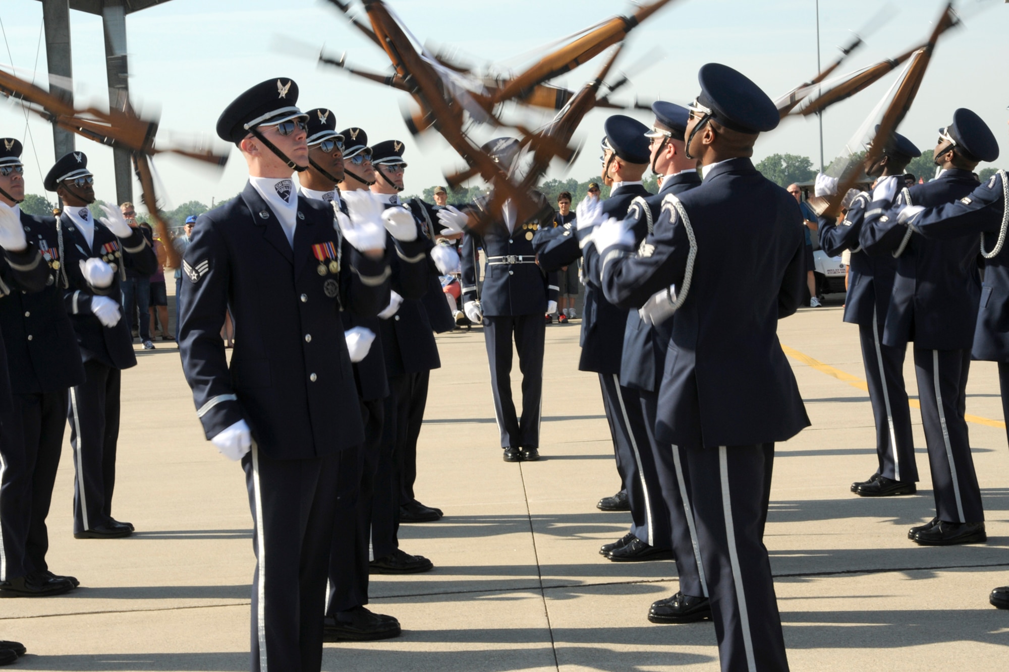 Members of the U.S. Air Force drill team perform at the 2011 Selfridge Air Show and Open House at Selfridge Air National Guard Base, Mich., Aug 20, 2011. The drill team amazed large crowds at the show with their precision performance. (USAF photo by TSgt. David Kujawa) 