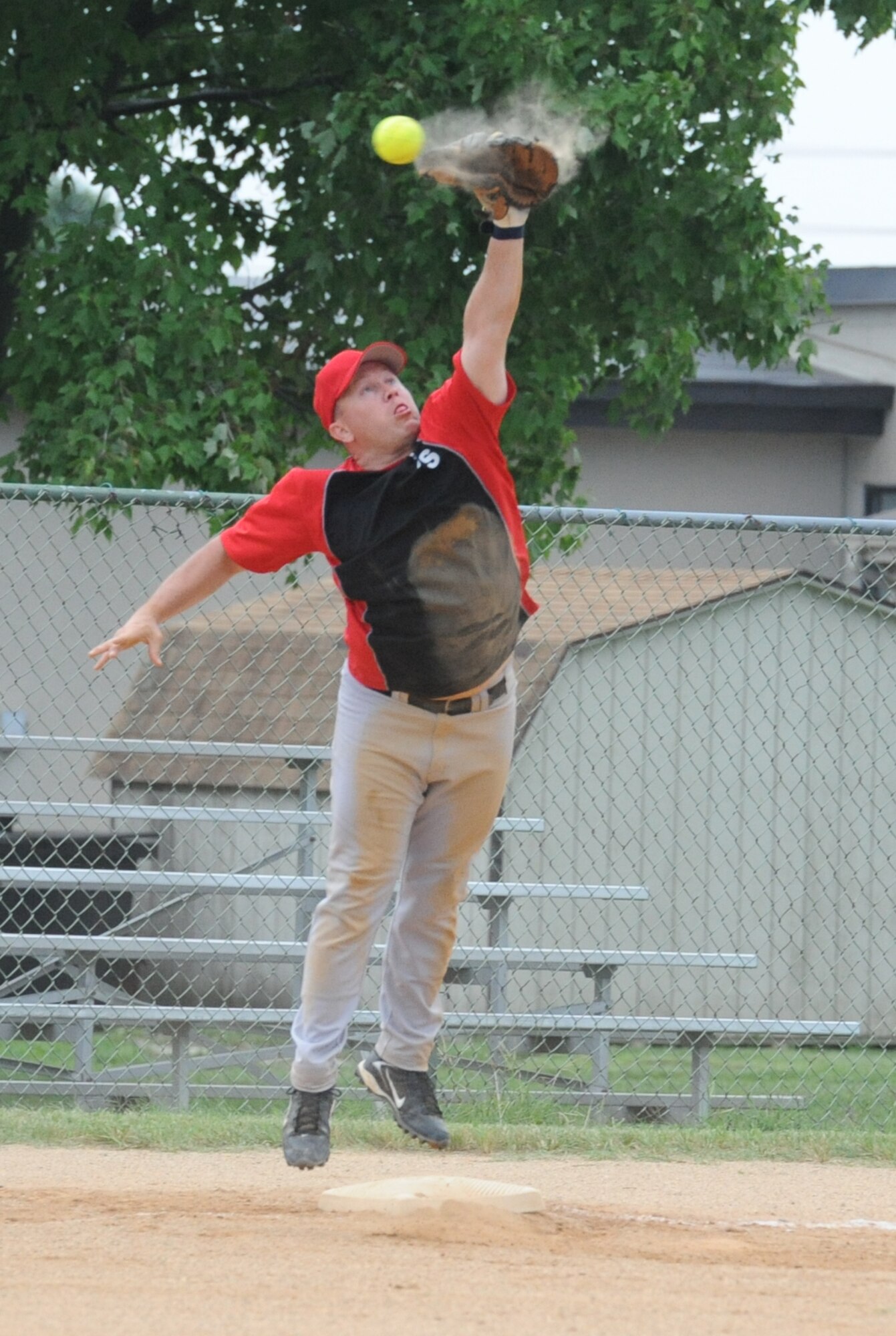 Michael Jobin, 436th Civil Engineer Squadron third baseman, just misses a catch during the intramural softball championship game August 19.  436th Aircraft Maintenance Squadron defeated 436 CES A 4-3.  (U.S. Air Force photo by Staff Sgt. Chad Padgett)