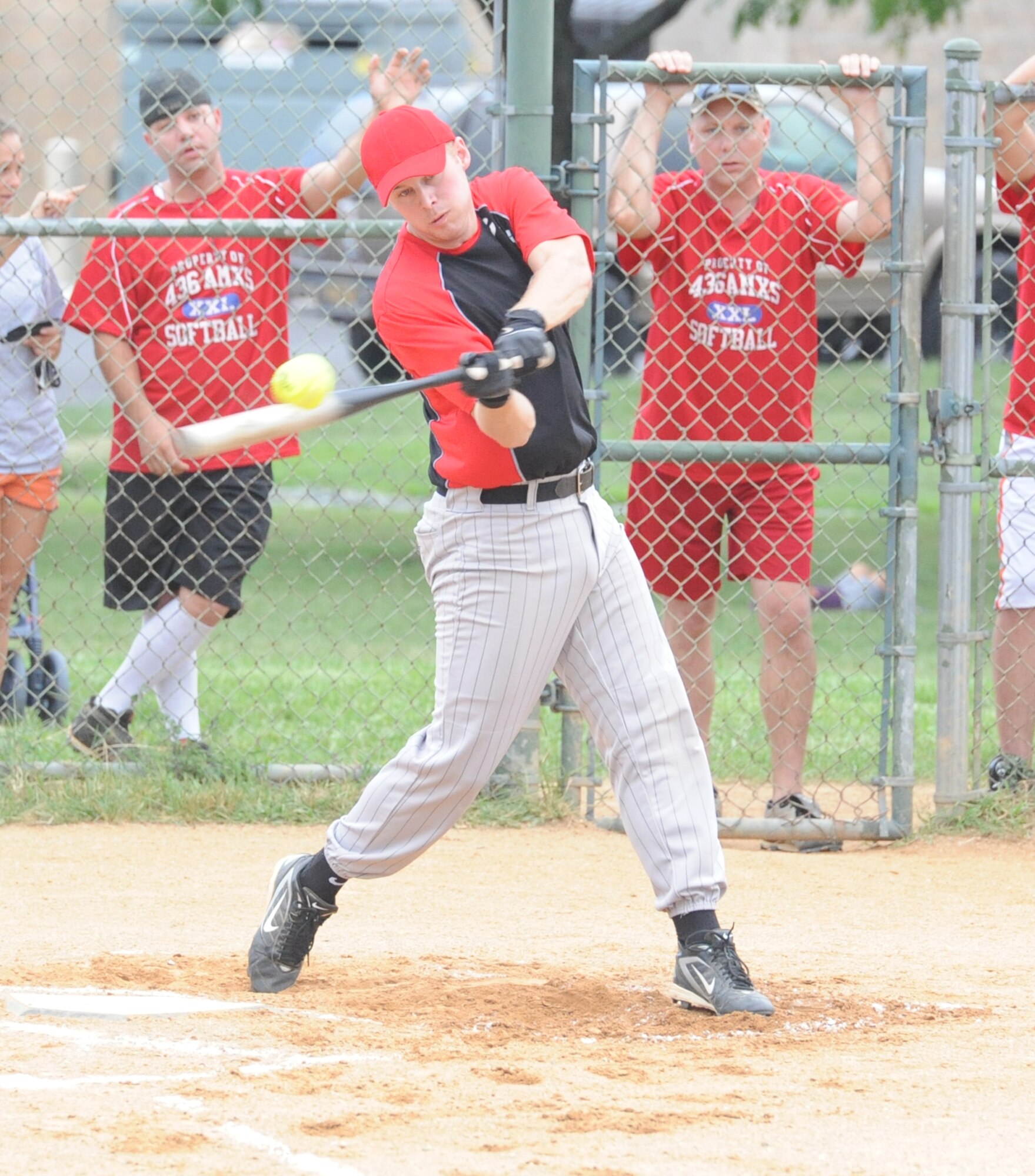 Chad Diehl, 436th Civil Engineer Squadron, hits a pop fly during the intramural softball championship game against the 436th Aircraft Maintenance Squadron August 19.  436 AMXS defeated 436 CES A 4-3.  (U.S. Air Force photo by Staff Sgt. Chad Padgett)