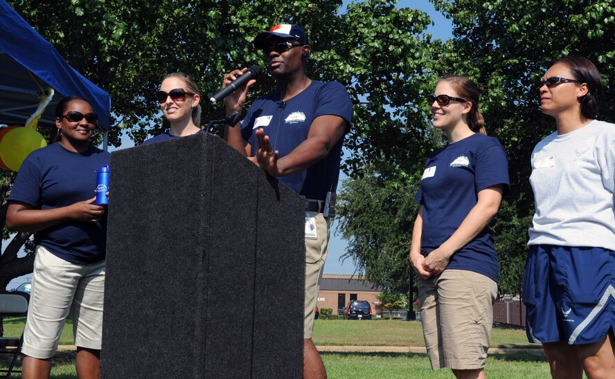 U.S. Air Force Tech. Sgt. Lawrence Black, 20th Aerospace Medical Squadron health fitness specialist, gives the opening speech during the health expo with Brenda Marshall, 20th Aerospace Medical Squadron office manager, Penny Cook, 20th AMDS health promotion flight chief, Janine Reinholtz, 20th AMDS registered dietition, and Tech. Sgt. Suzy Bright, 20th AMDS diet technician, who helped organize the expo at Shaw Air Force Base, S.C. Aug. 19, 2011. The health expo was held to give Airmen, Soldiers and their families the opportunity to receive health and wellness education. (U.S. Air Force photo/Airman 1st Class Tabatha L. Duarte)(Released)